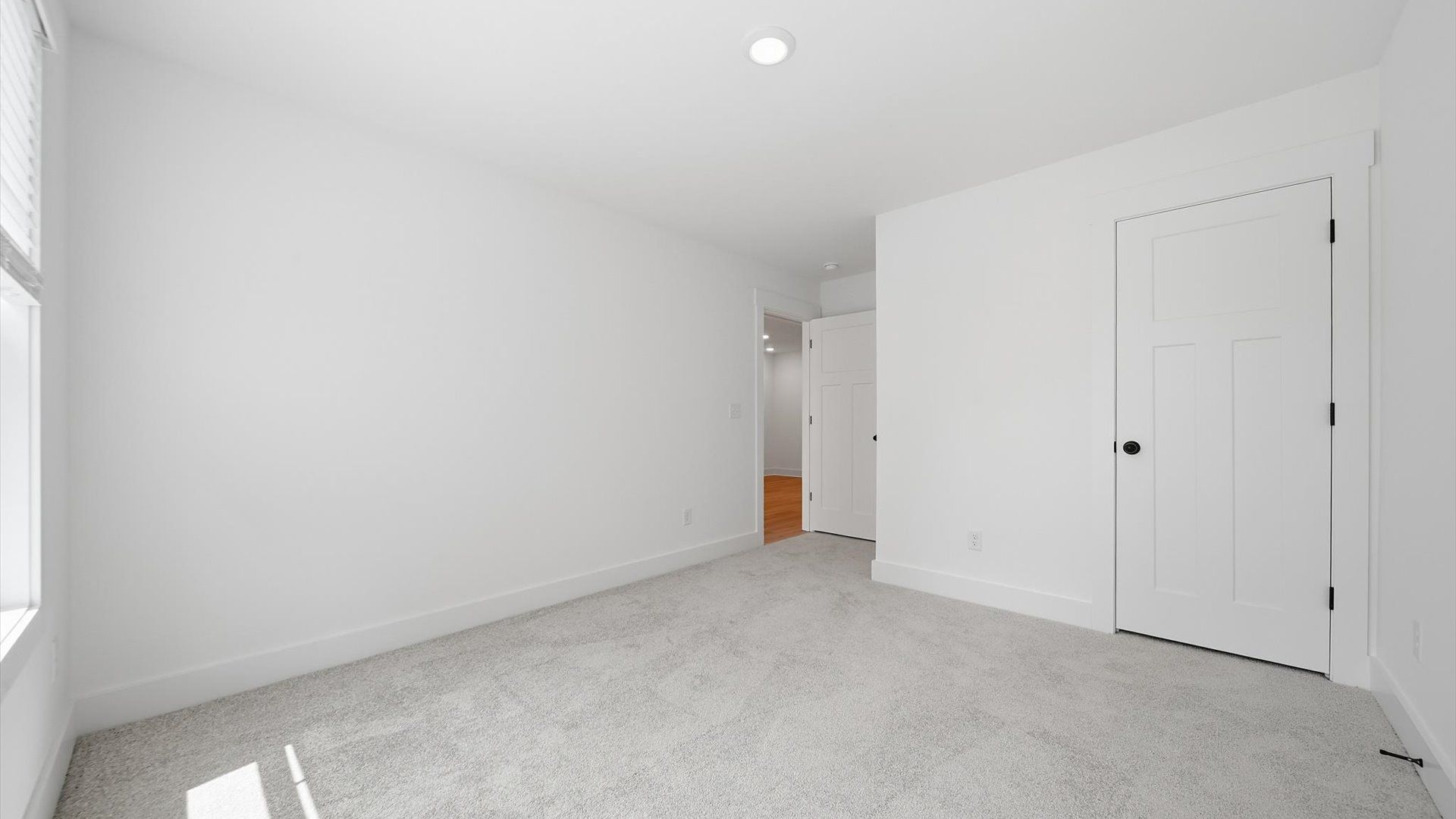 First-class secondary bedroom with comfortable carpeted flooring and generous closet space