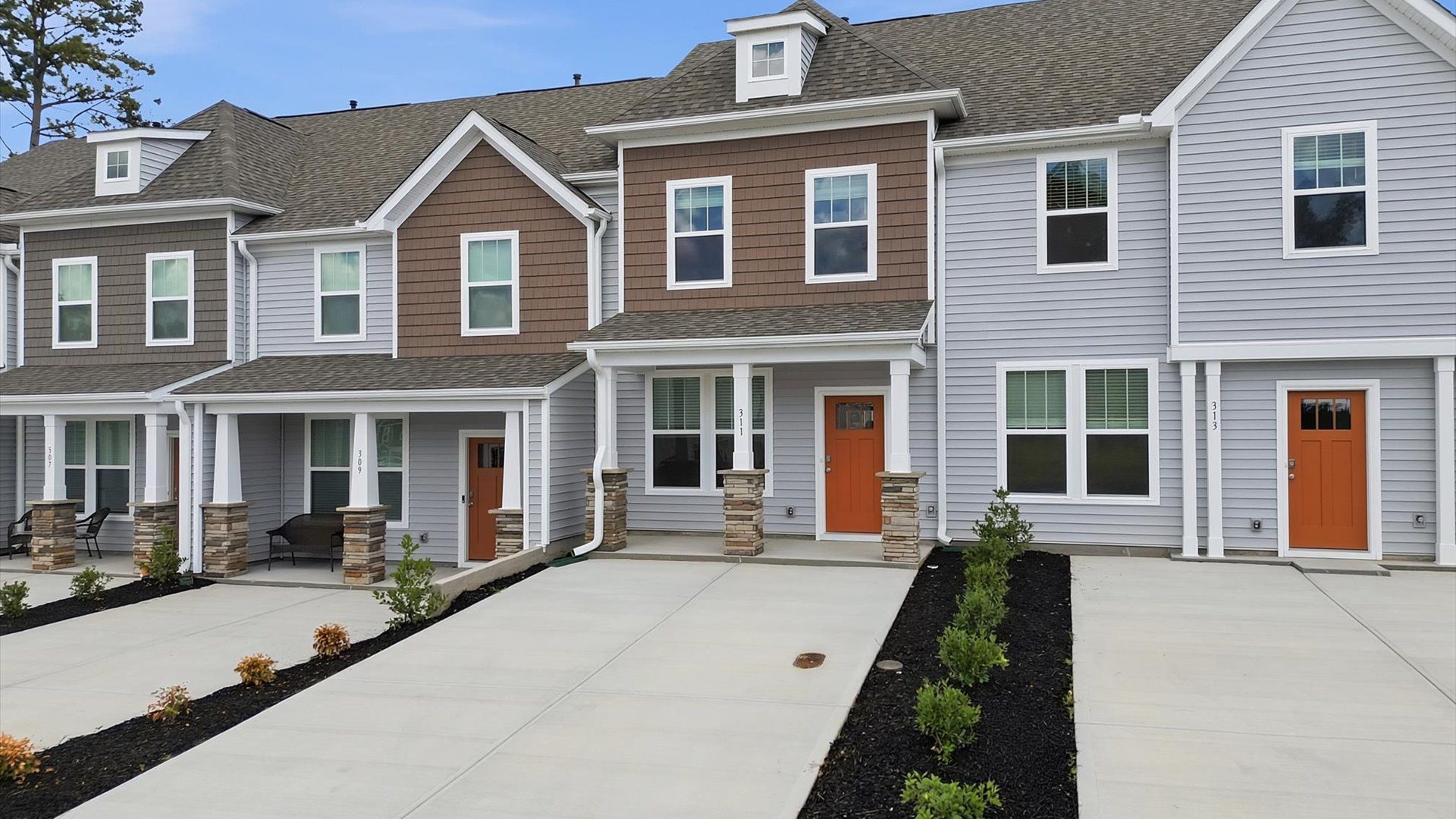 Exclusive DRB Homes exterior with balanced proportions and vibrant curb appeal