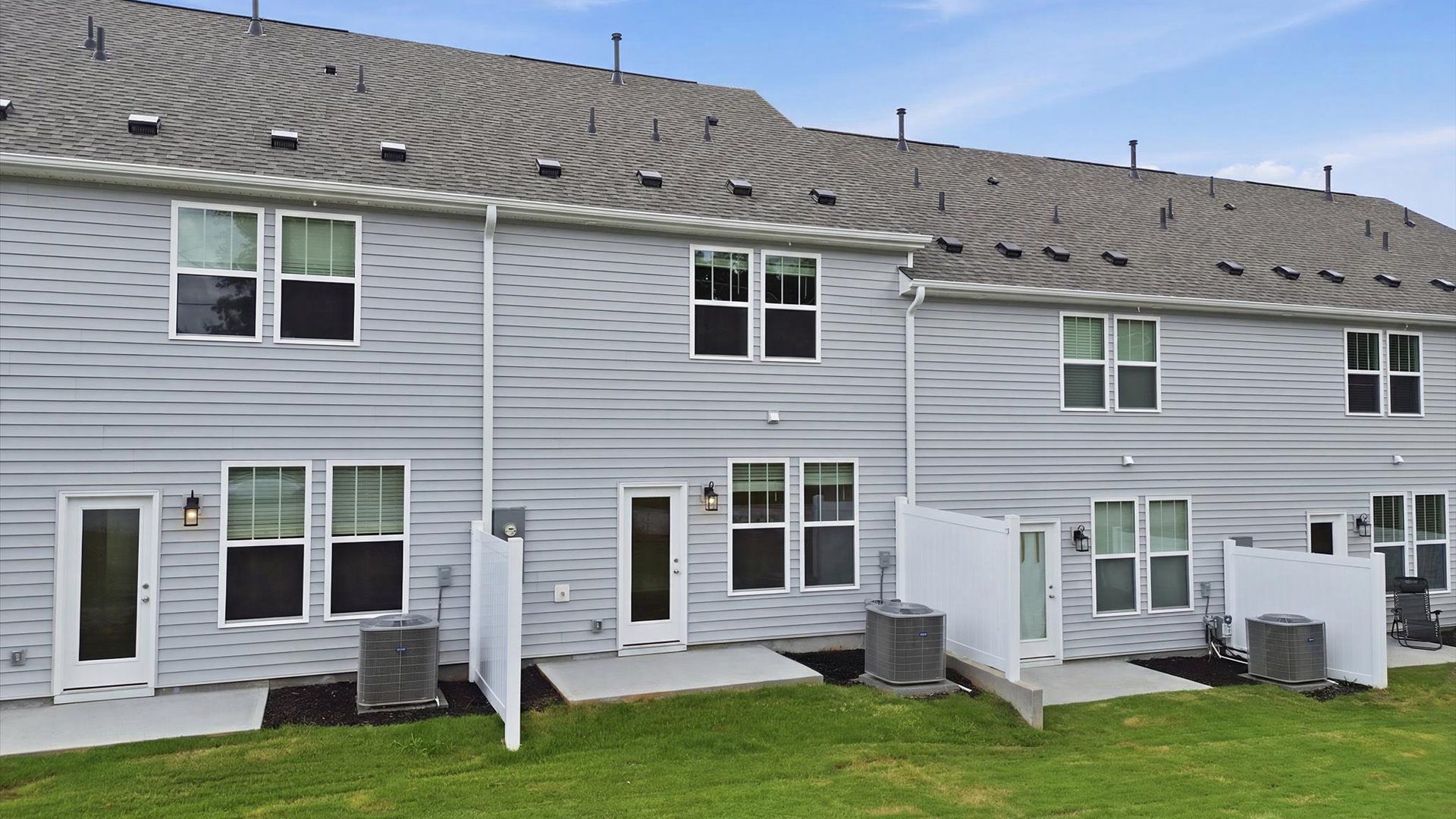 Vibrant rear outdoor space featuring a rear patio and exceptional craftsmanship