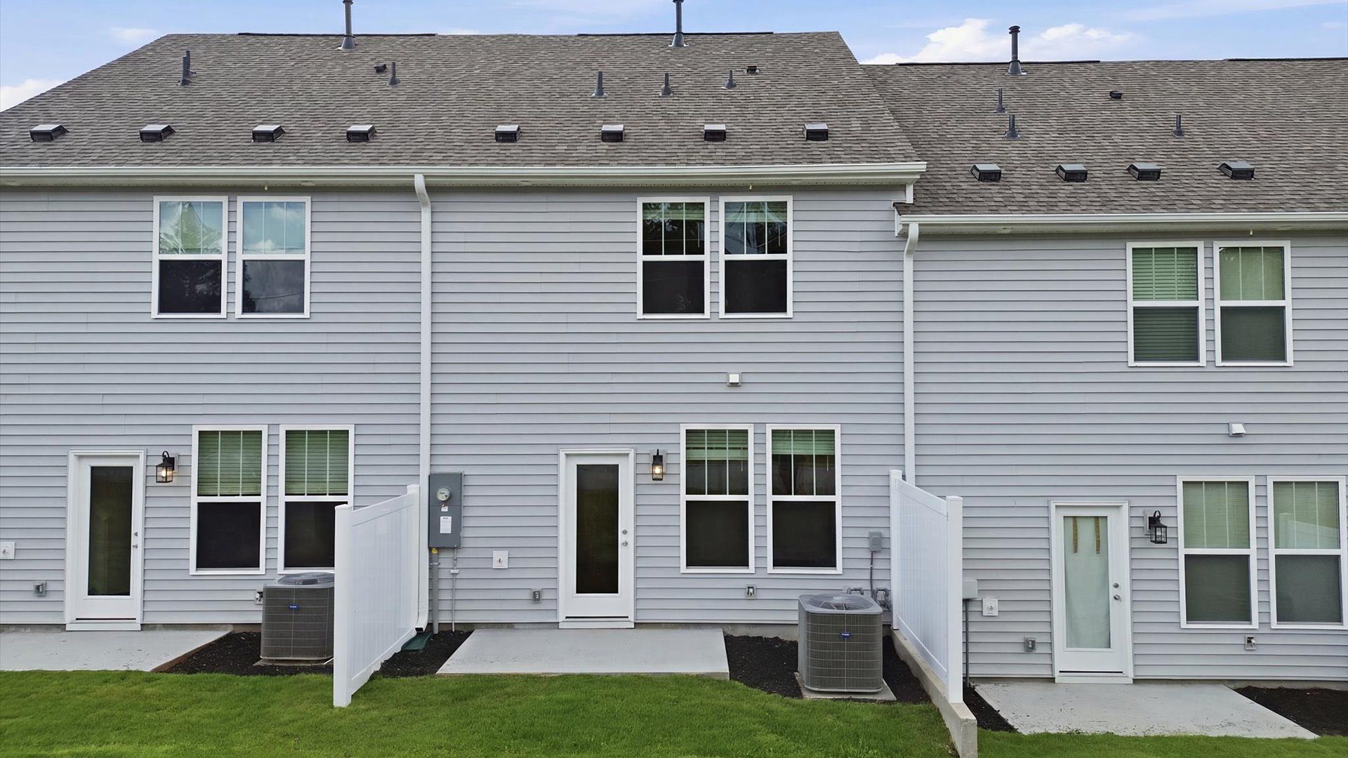 Accomplished exterior with a spacious rear patio that blends comfort and style