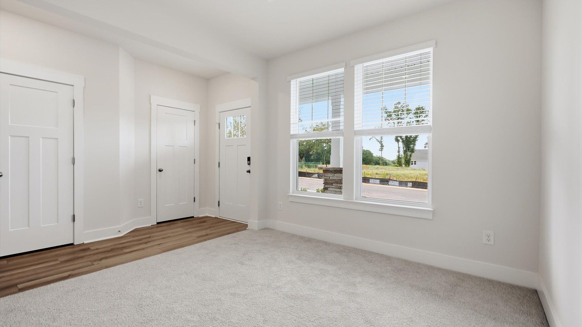 Accomplished design showcases a spacious flex room with exceptional flow and versatile functionality