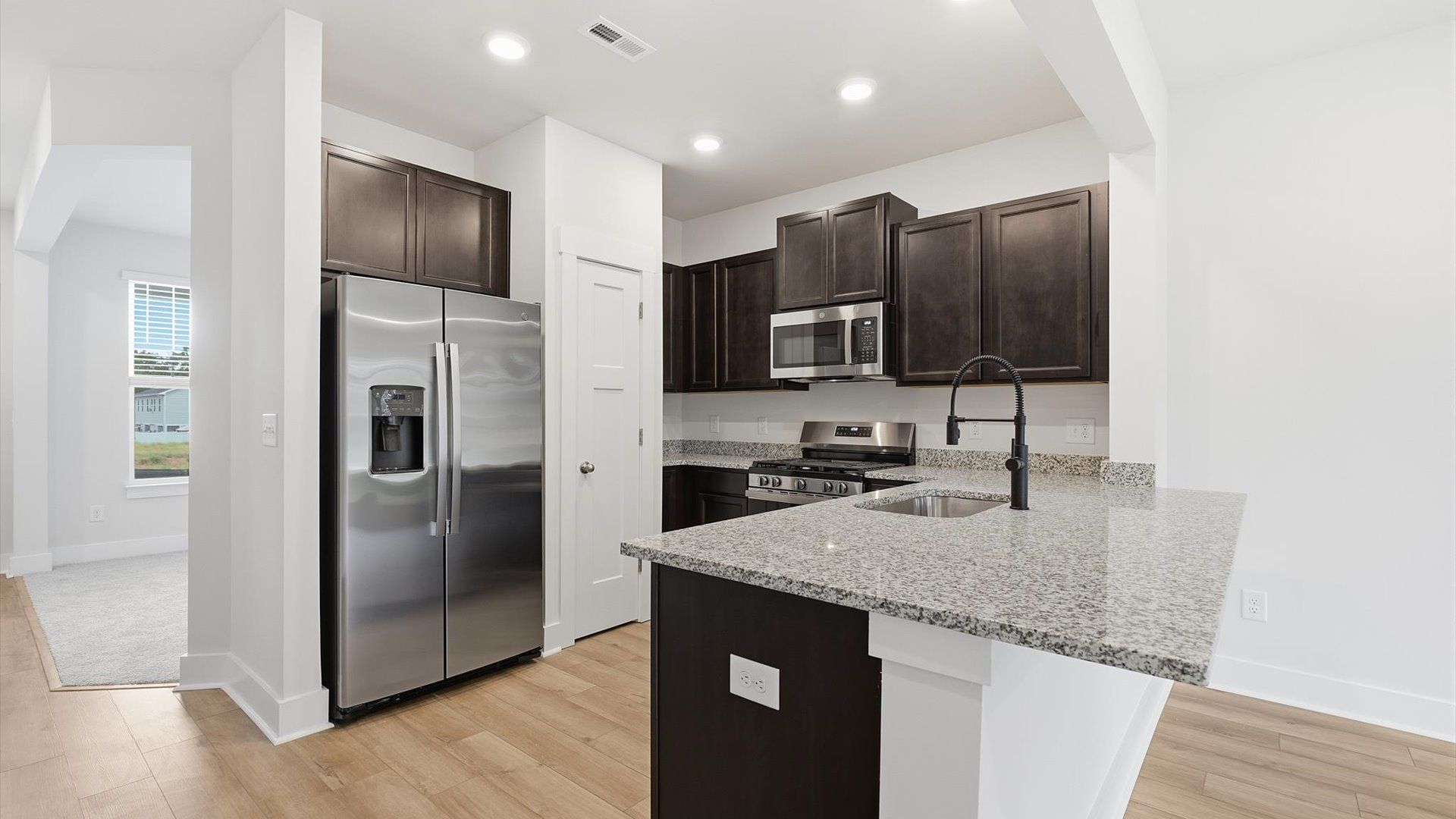 Elegant kitchen with stylish cabinetry, generous workspace, and timeless appeal throughout