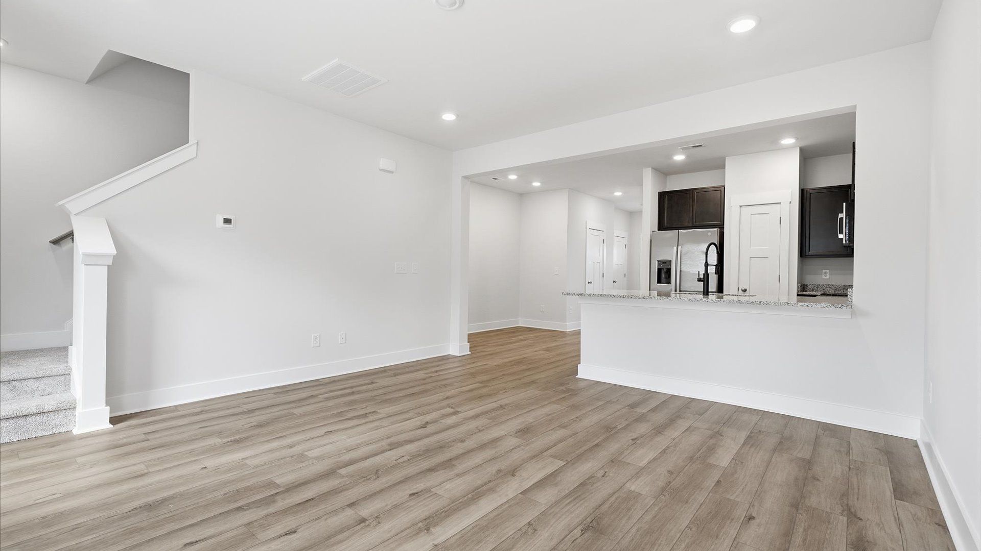 Spacious family room with accomplished design and eye-catching details throughout