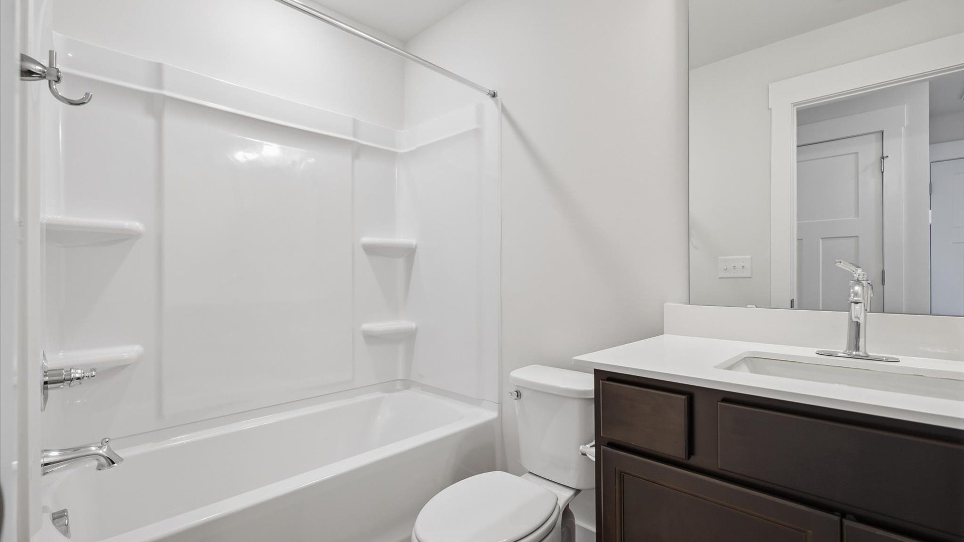 Vibrant and welcoming bathroom with elegant countertop space and polished details