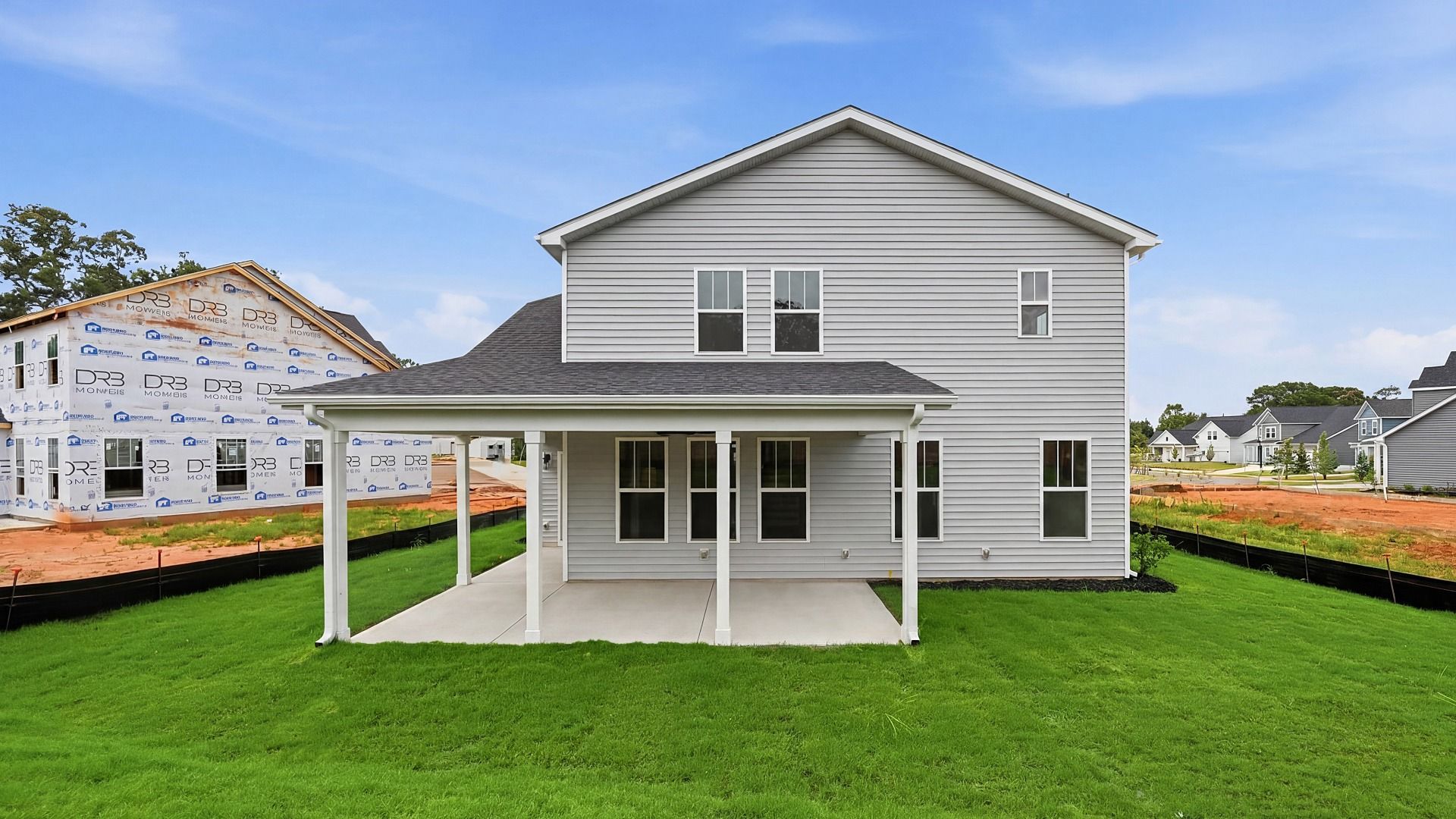 Refined rear exterior with a stylish covered porch for dining, relaxing, or entertaining in Piedmont, SC