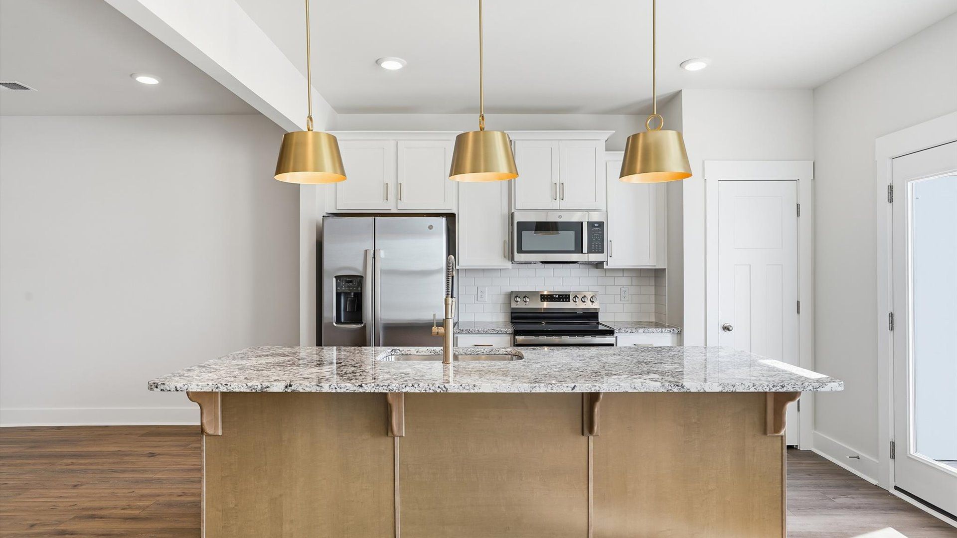 Tasteful kitchen with a streamlined island and modern finishes in a first-class DRB Homes design