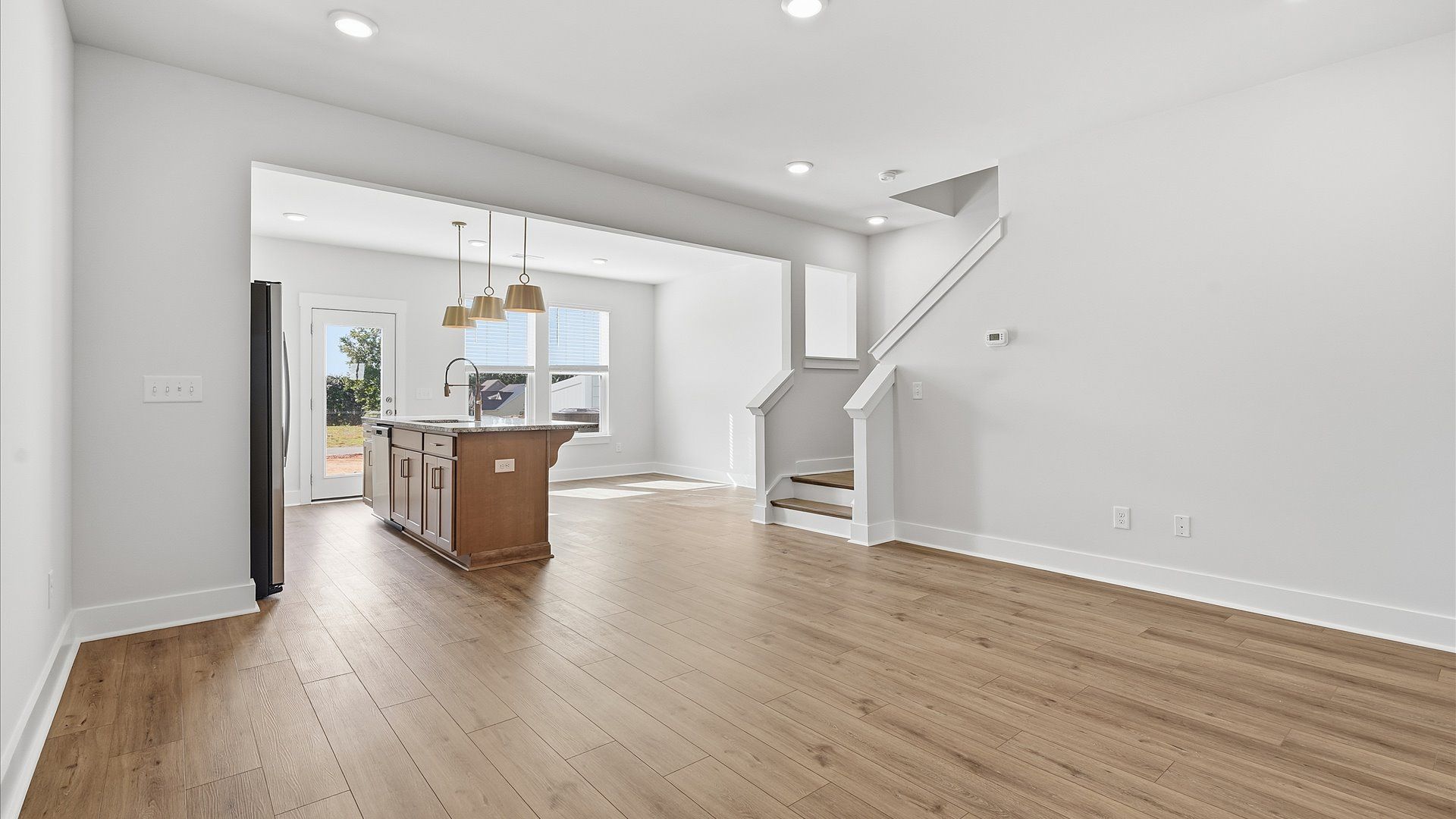 Hardwood flooring and high standards define this vibrant family room ideal for everyday living in Simpsonville, SC