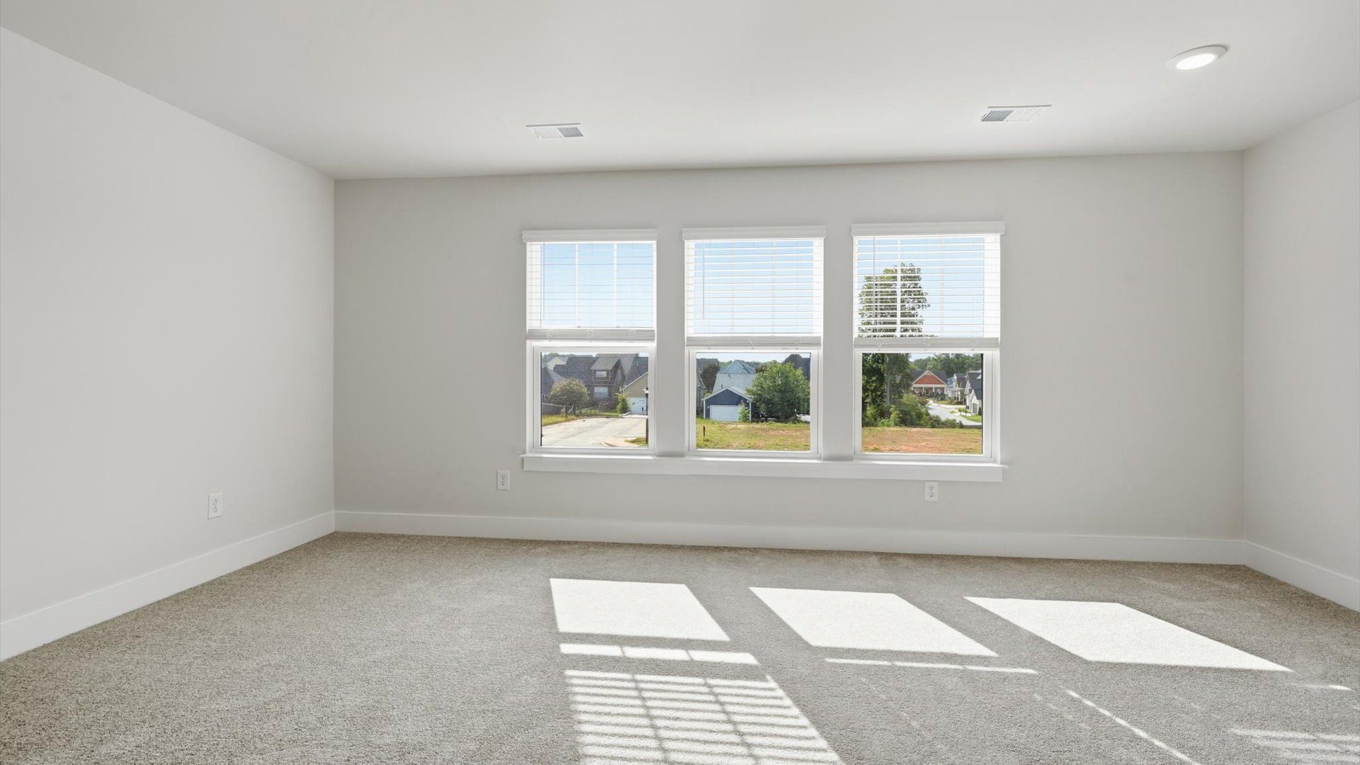 Eye-catching details and elegant finishes in the vibrant primary suite of this select home by DRB Homes