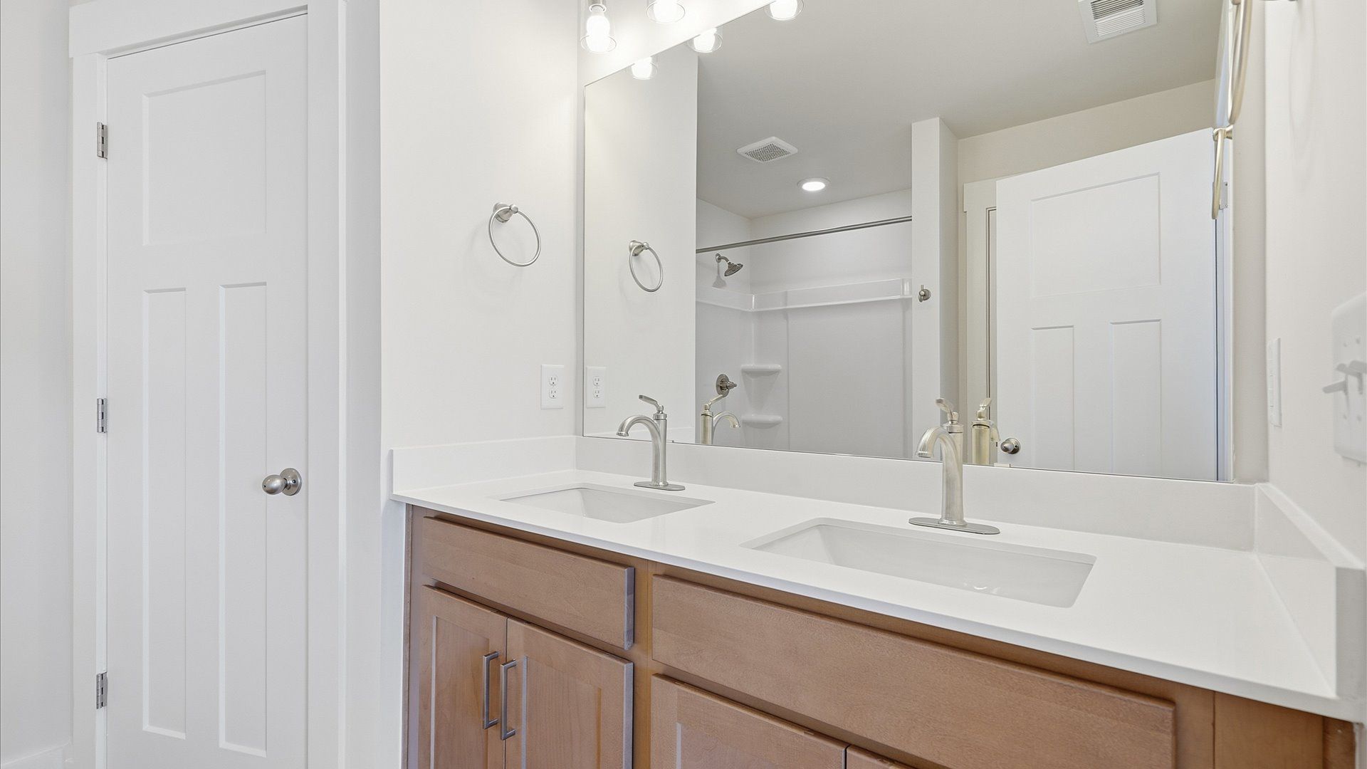 Notable primary bath featuring dual vanity, walk-in shower, and tasteful design touches throughout in Simpsonville, SC