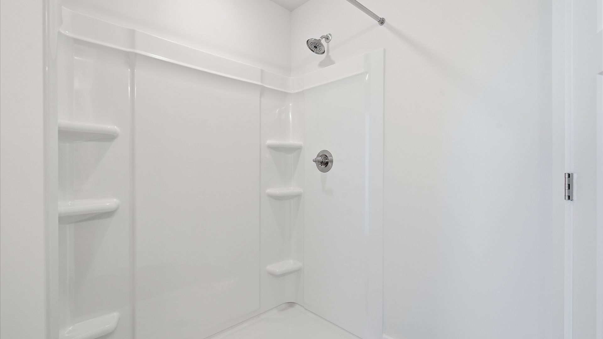 Superior en-suite primary bathroom with a walk-in shower—crafted with high standards in mind by DRB Homes