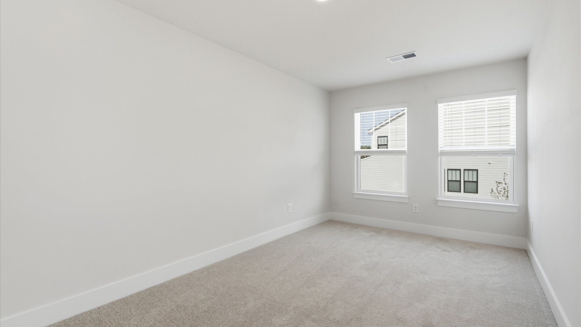 Vibrant and inviting secondary bedroom featuring a walk-in closet and refined finishes near Downtown Simpsonville
