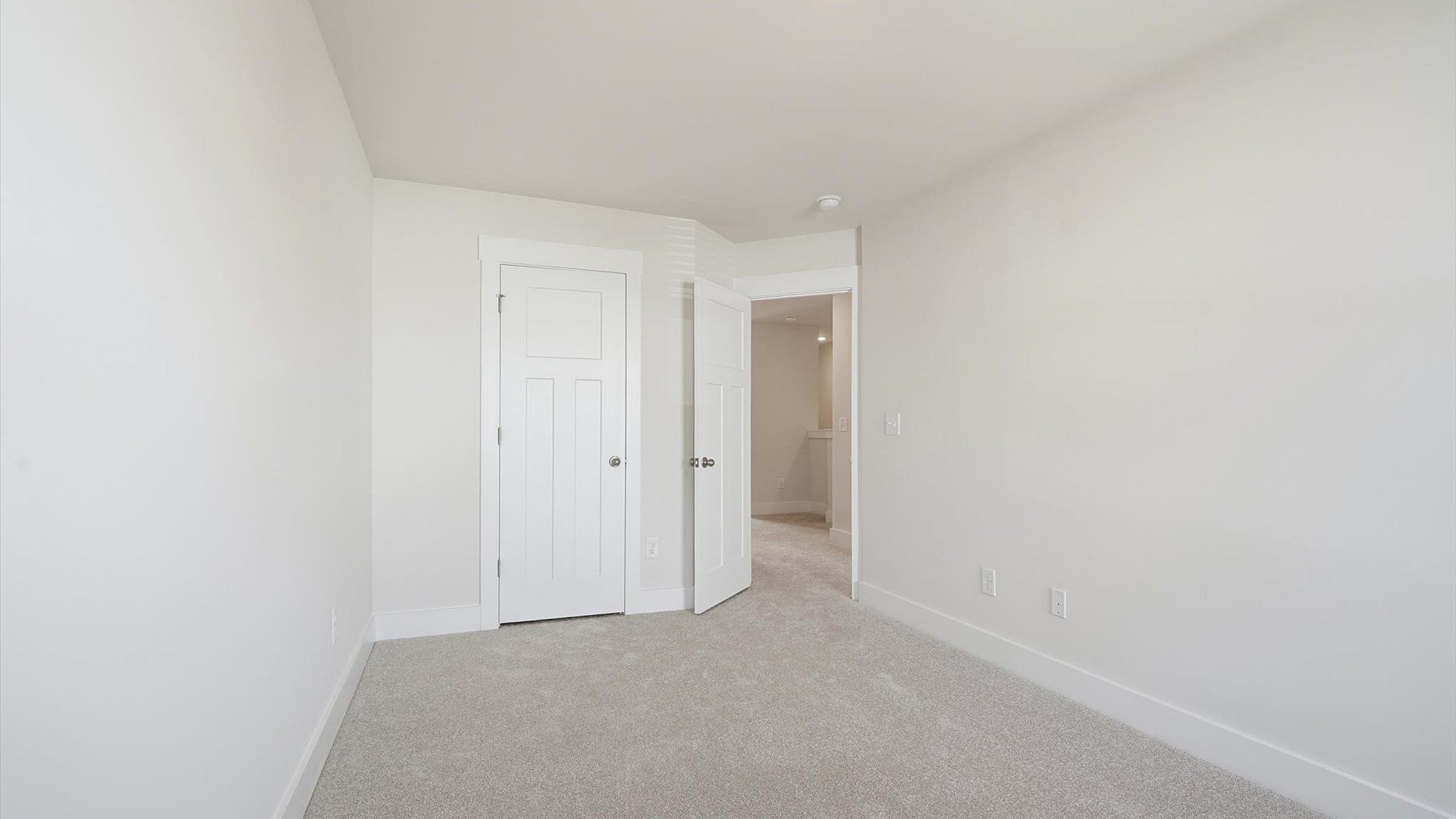 Notable secondary bedroom offering cozy carpeted flooring and a stylish walk-in closet at the Gresham Station community