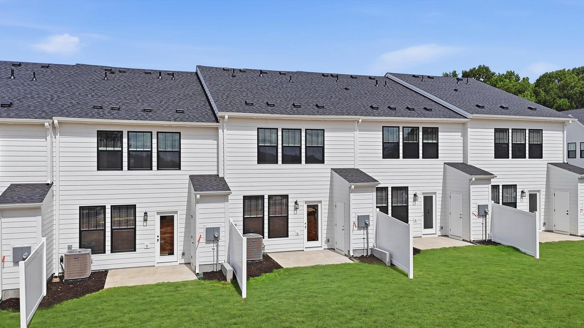 Refined rear exterior with a stylish and private backyard for dining, relaxing, or entertaining near Downtown Simpsonville
