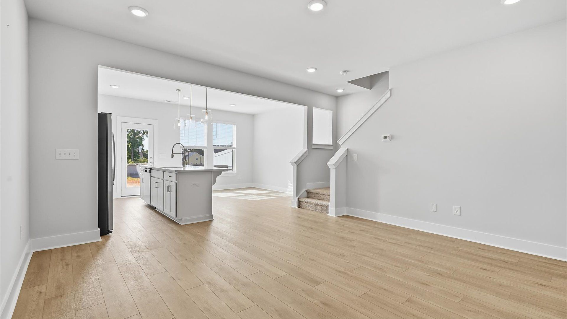 Exceptional family space with hardwood floors and seamless flow to dining and kitchen areas near Downtown Simpsonville