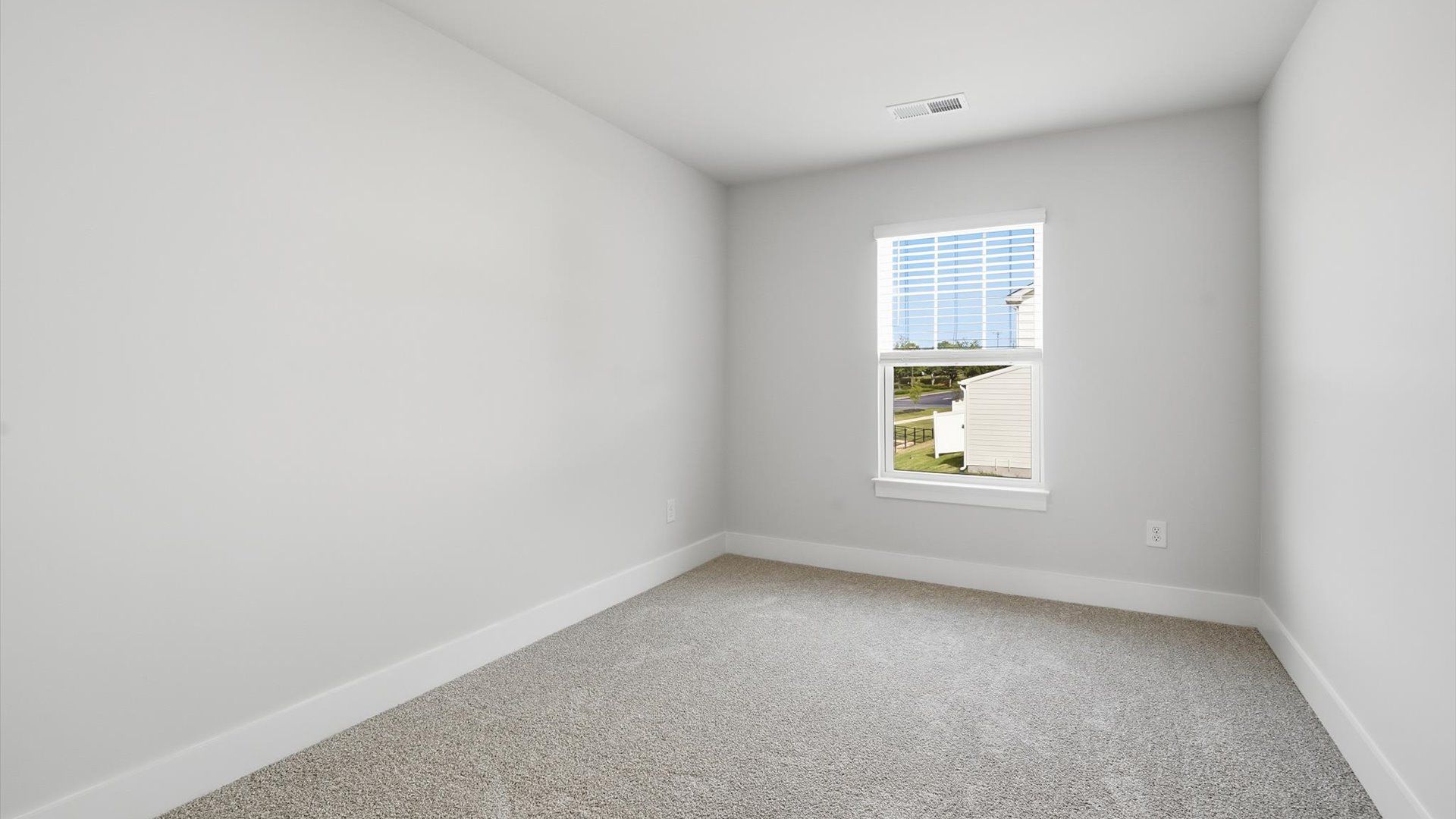 First-class bedroom with generous proportions, a walk-in closet, and beautiful natural light through a large window