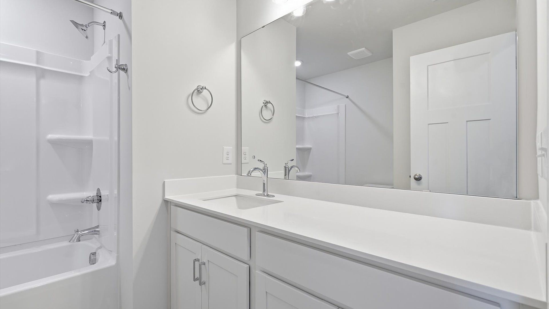 Stylish guest bathroom with superior design and thoughtful storage solutions located in Simpsonville, SC