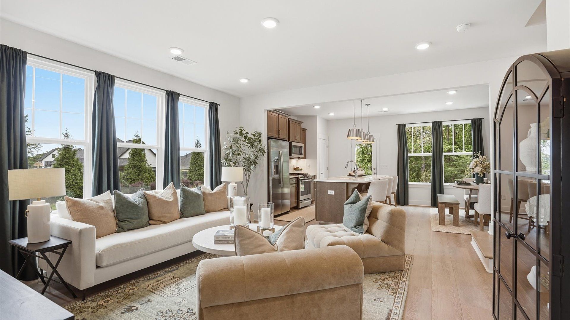 First-rate family room with thoughtful layout and superior connection to kitchen and dining spaces at Gresham Station