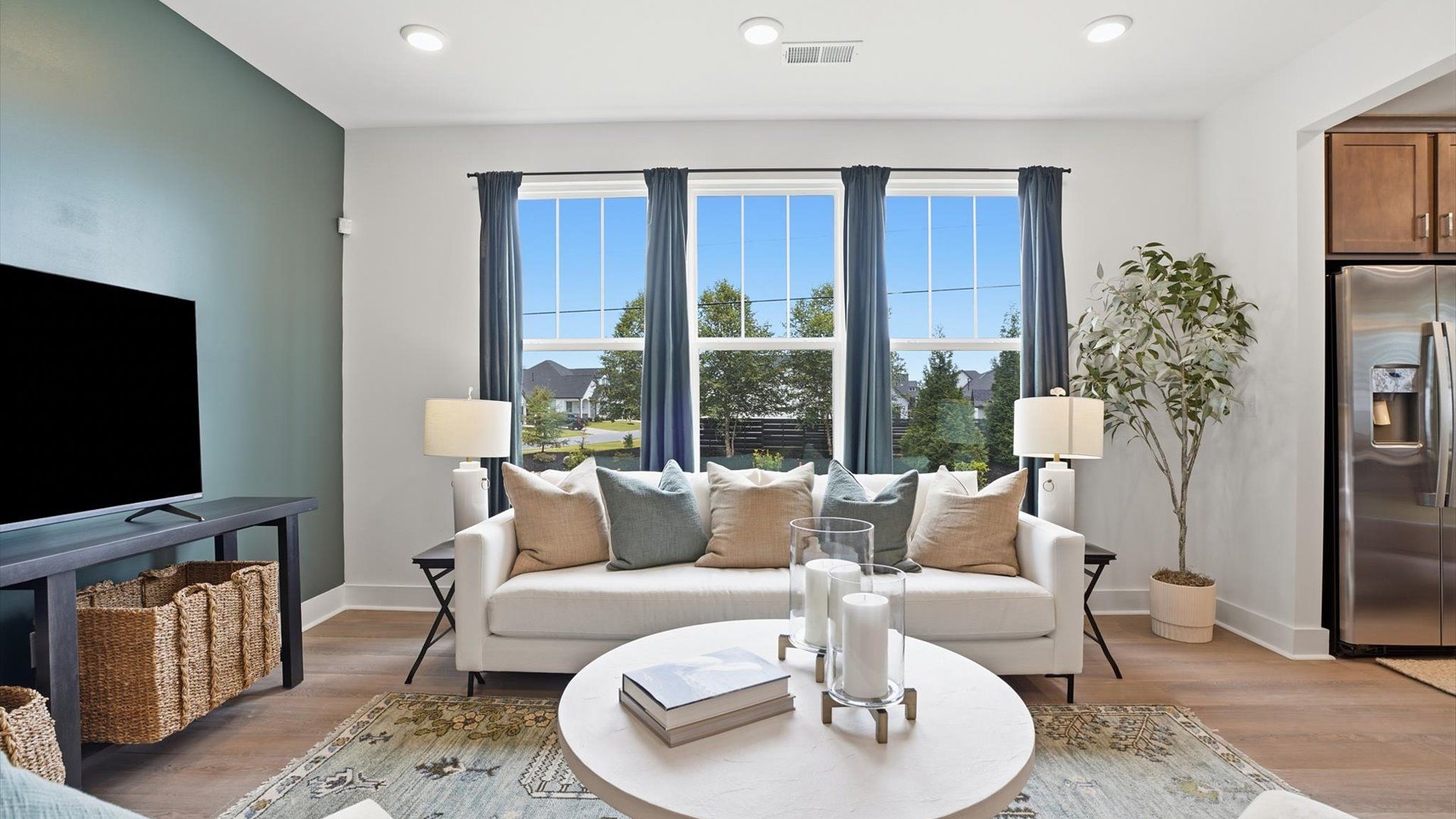 Exceptional kitchen featuring a spacious island, eye-catching pendant lights, and modern finishes in Simpsonville, SC