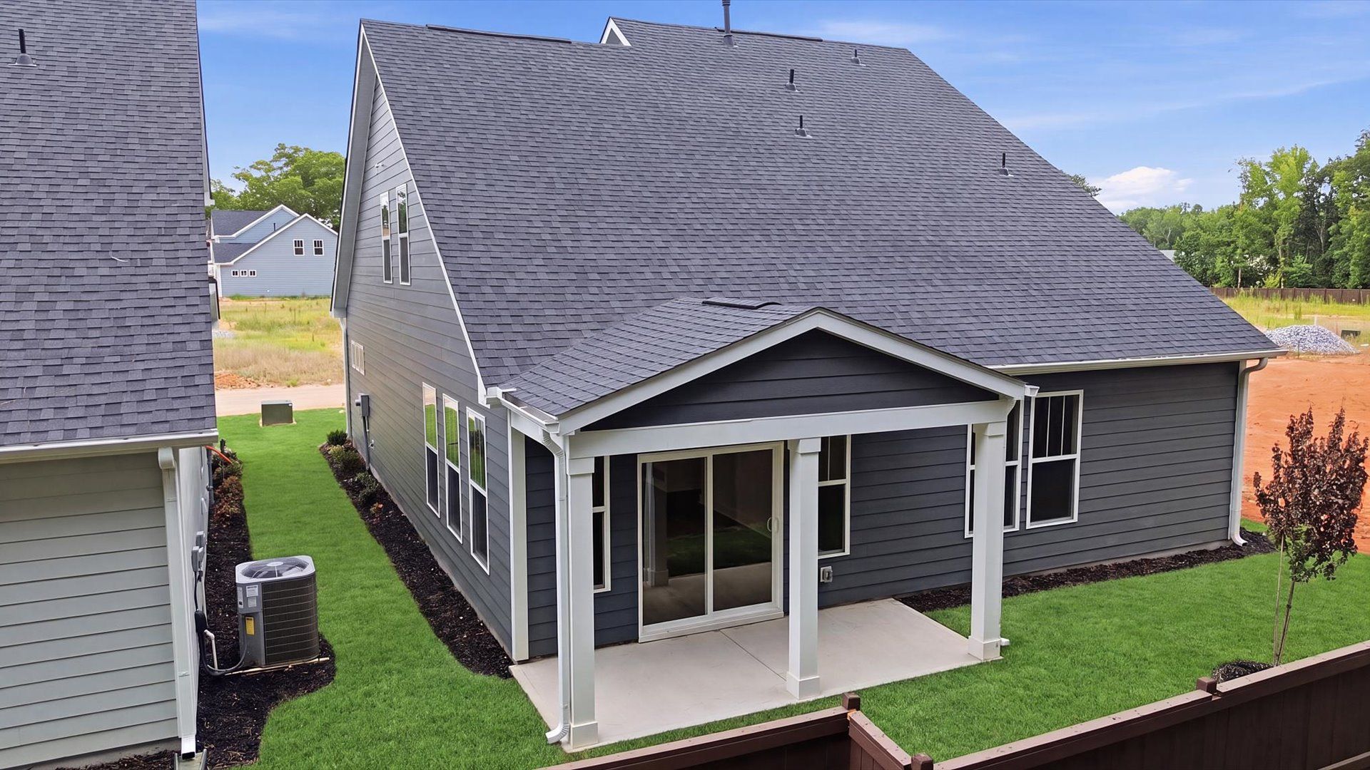 Exceptional outdoor living begins with a covered back porch in this thoughtfully designed home by DRB Homes