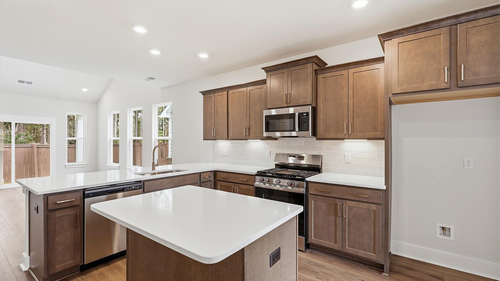 Well-designed kitchen with a center island and tasteful finishes that elevate everyday living at the Barton Hollow community
