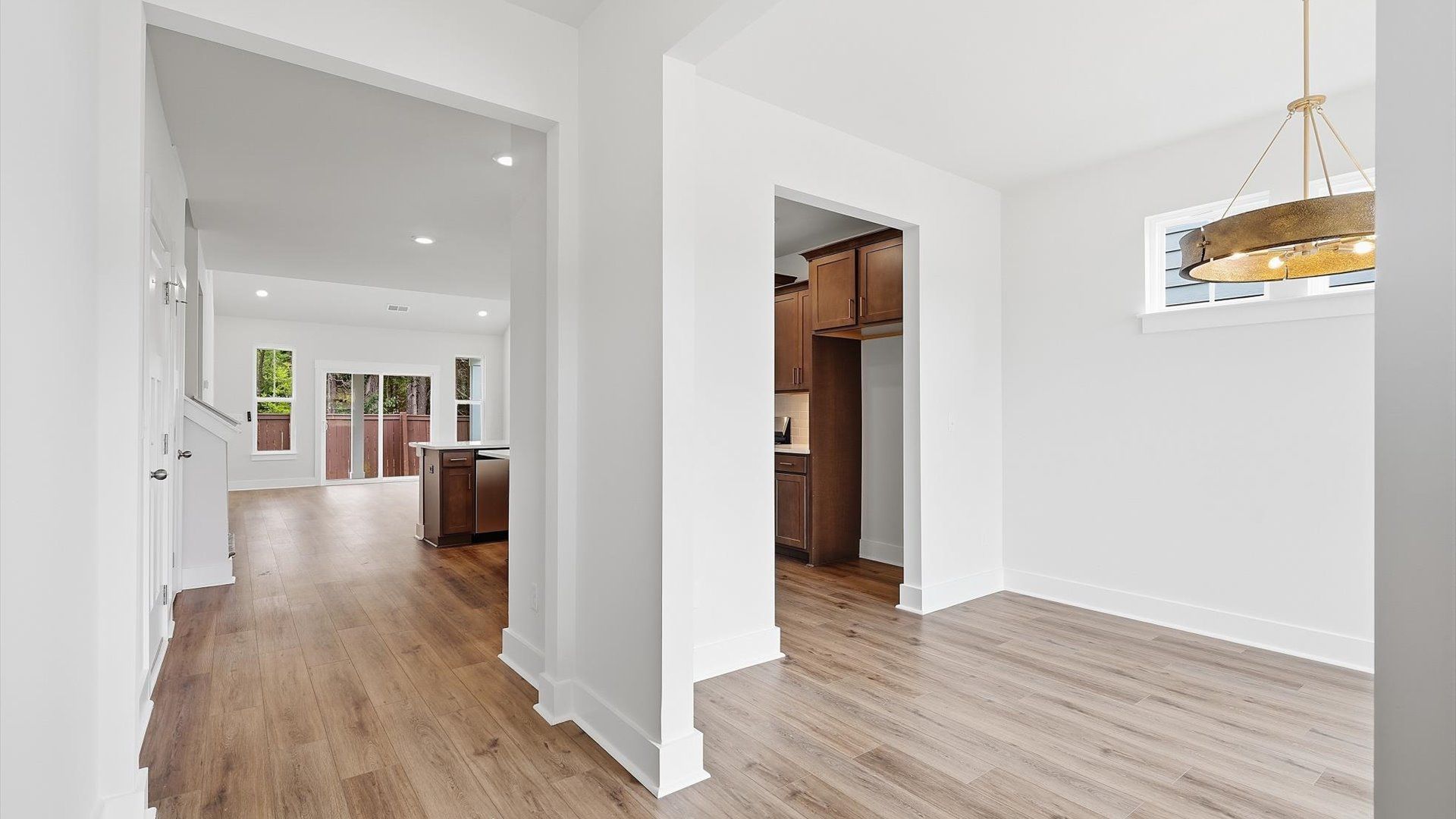 Superior design begins at the front door with a hardwood floor foyer and elegant sightlines at Barton Hollow