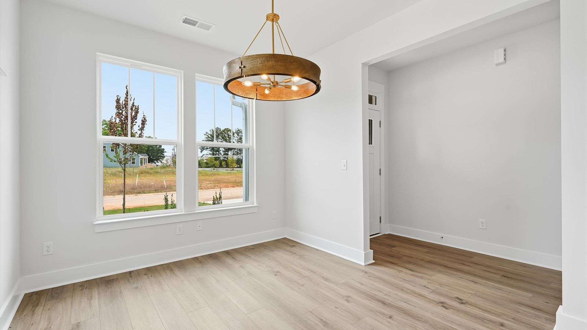 Established charm meets modern elegance in this first-rate dining room by DRB Homes