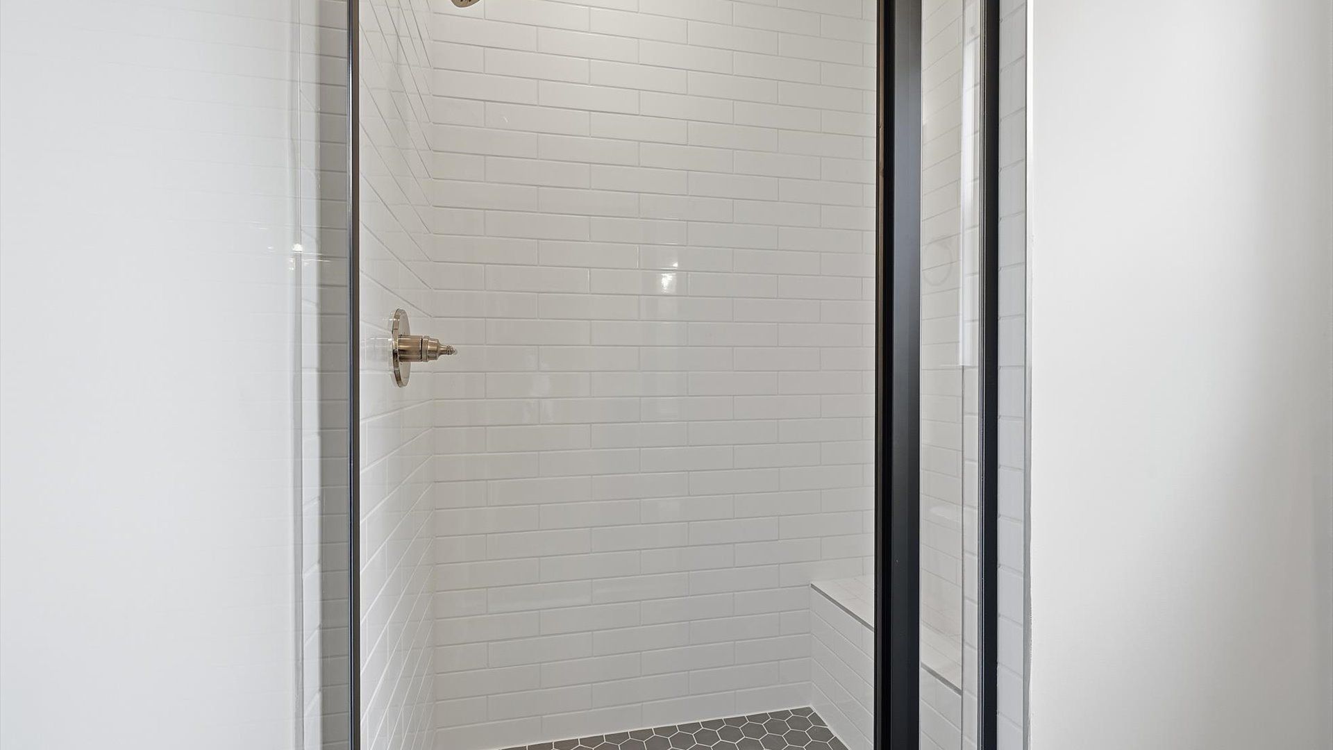 Memorable mornings begin in this elegant primary bathroom with walk-in shower and natural light at Barton Hollow