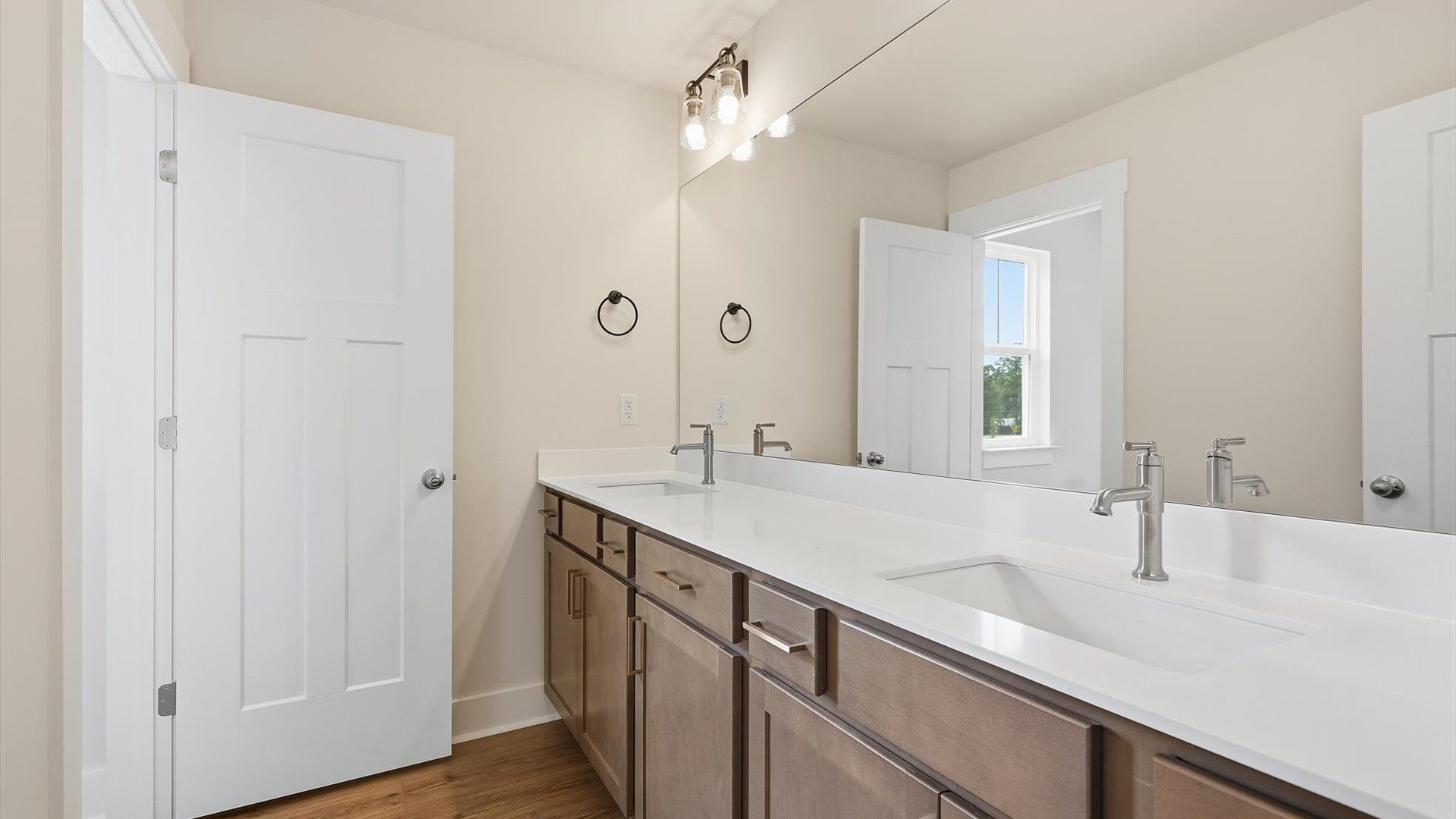 Top-notch bathroom with current fixtures, tasteful materials, and elevated charm by DRB Homes