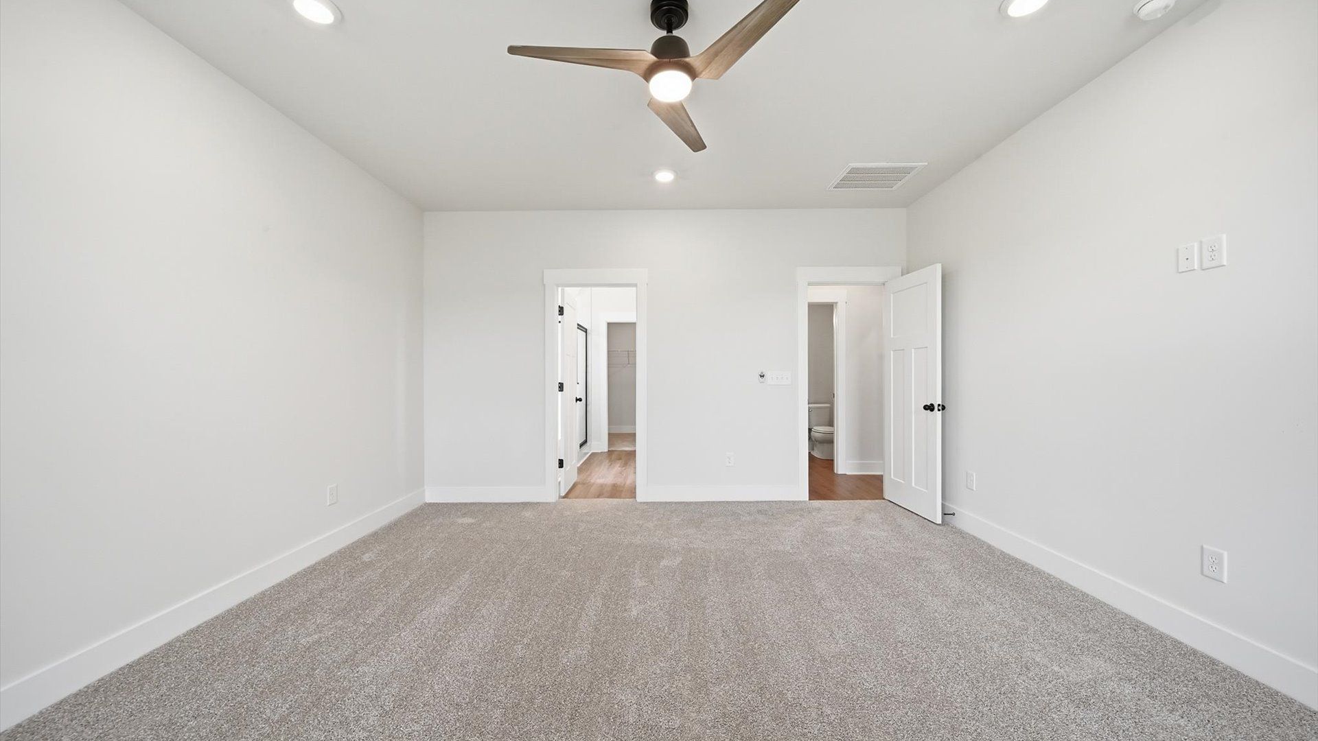 Eye-catching details and elegant finishes in the vibrant primary suite of this select home at Harrier Point