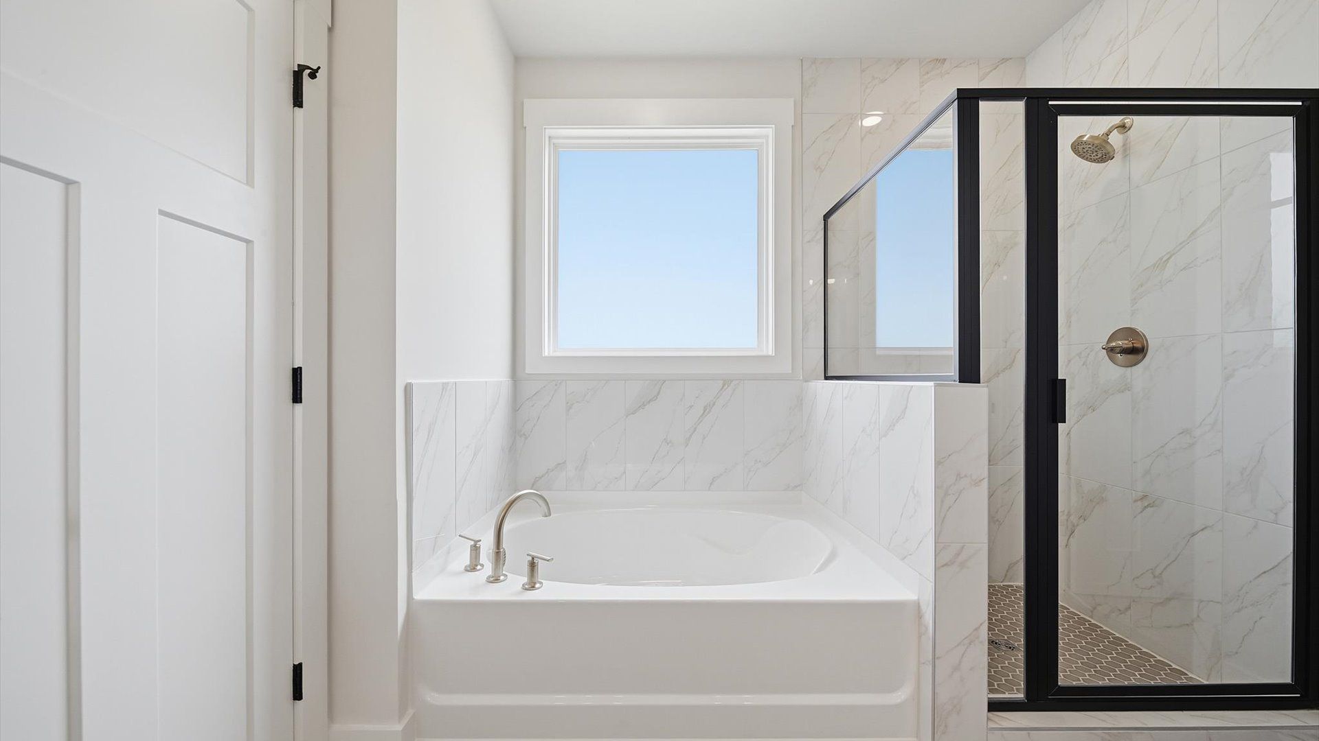 Superior en-suite primary bathroom with a walk-in shower—crafted with high standards in mind