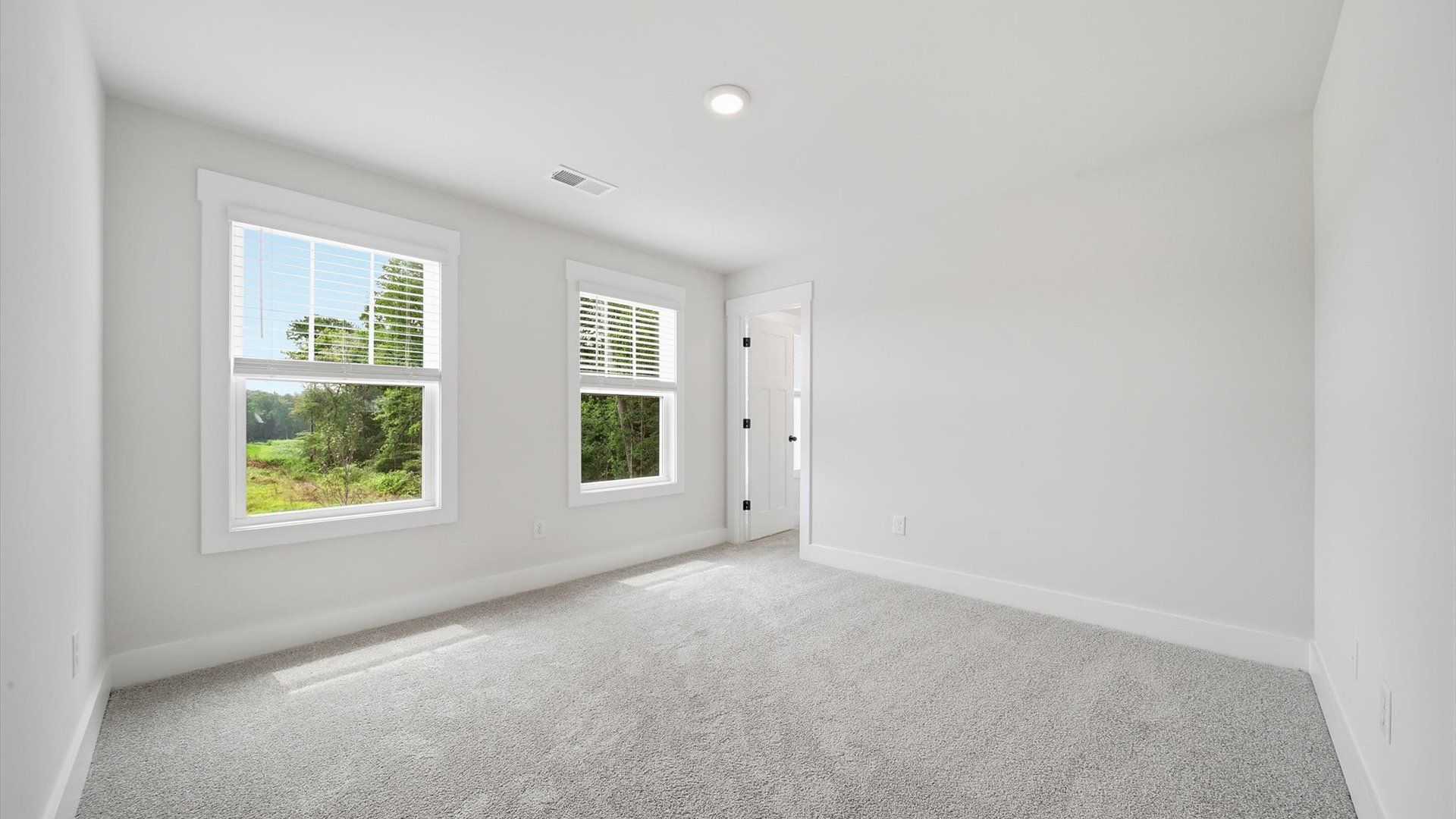 Thoughtfully designed secondary room with plush carpeting and generous proportions located in Woodruff, SC