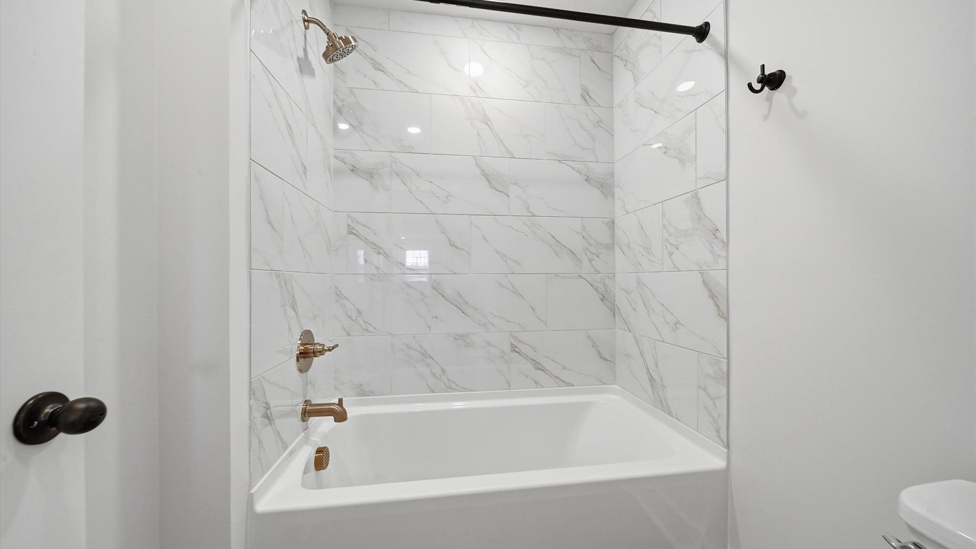 Elegant bath retreat with designer finishes and a clean, timeless aesthetic at the Harrier Point community