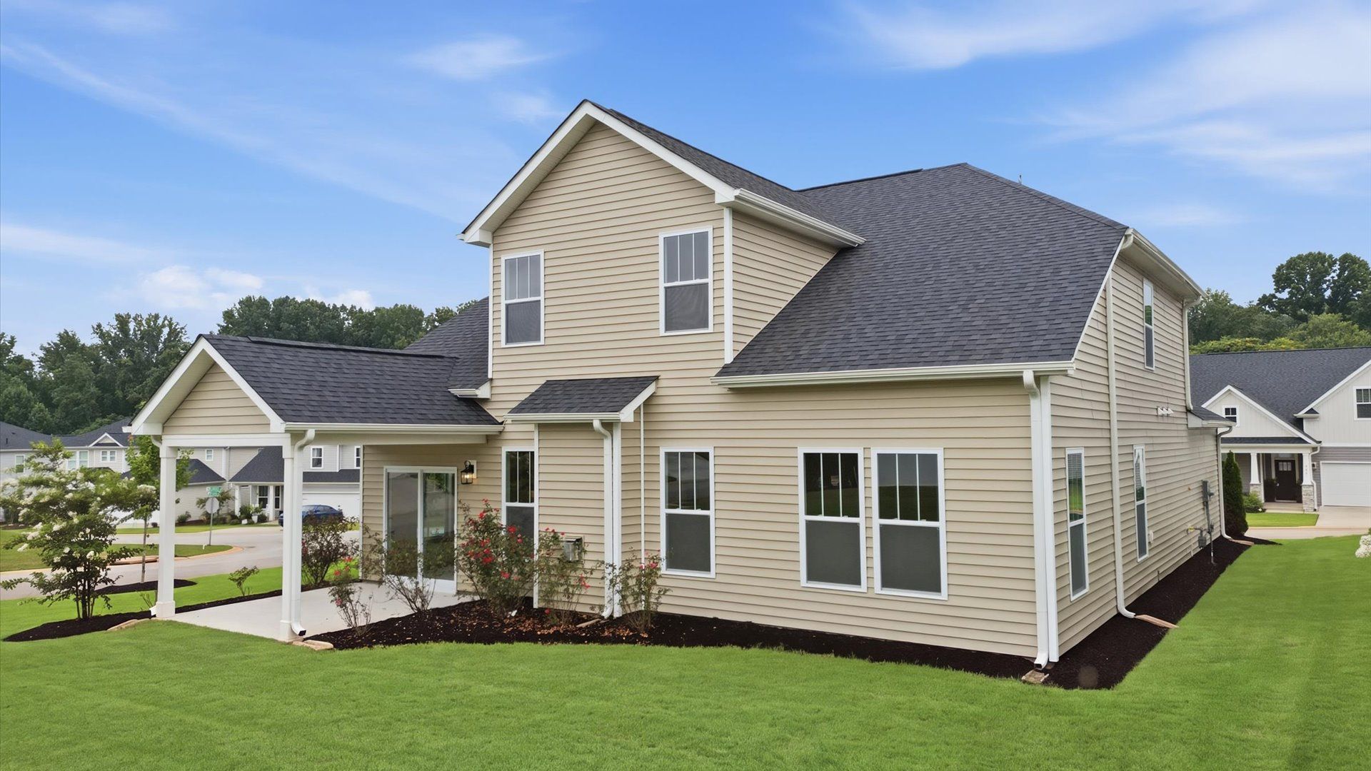 Warm and inviting outdoor living space with a covered rear porch and tasteful finishes in Spartanburg, SC