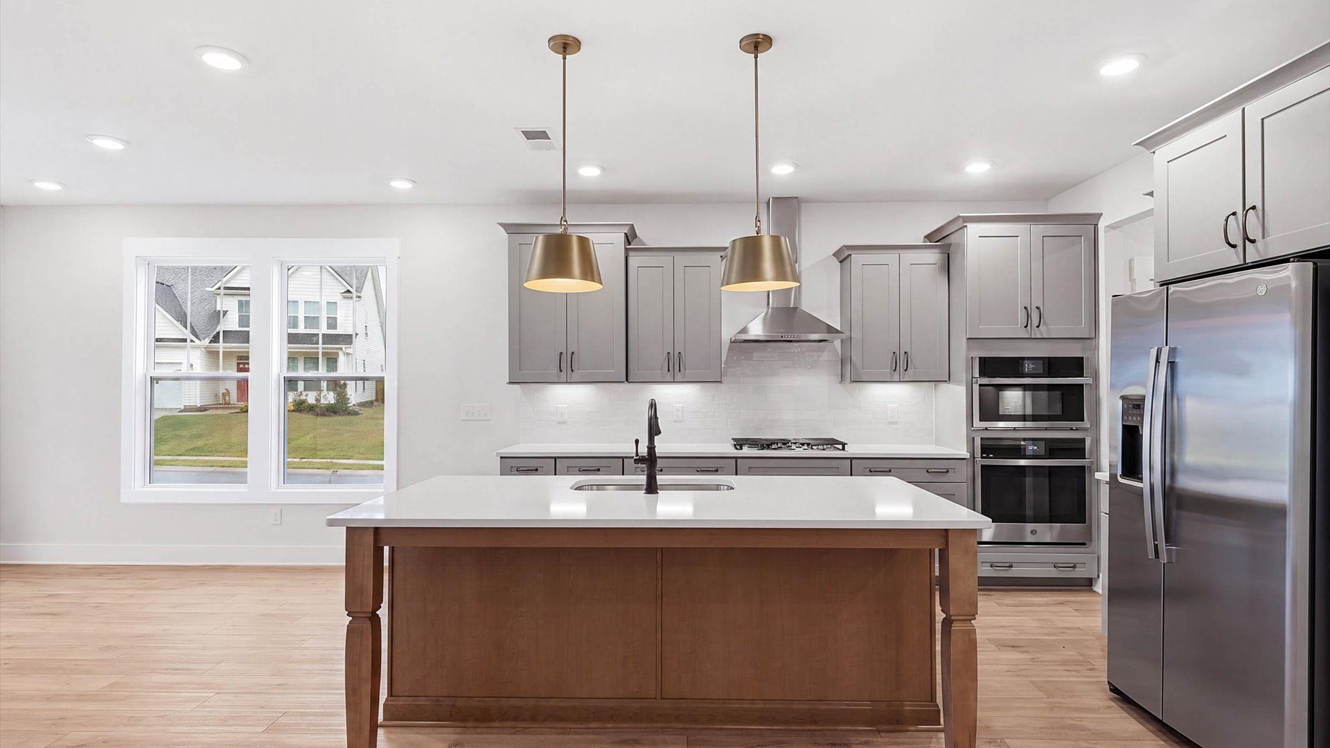Beautifully appointed kitchen with spacious counters and sophisticated detailing at Fox Hollow