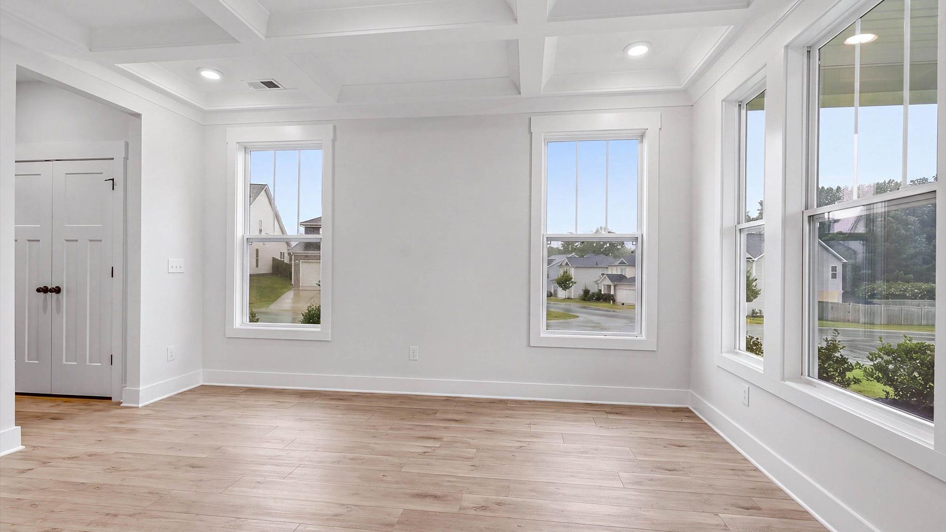 Modern layout with classic touches like a coffered ceiling in this select Fox Hollow home