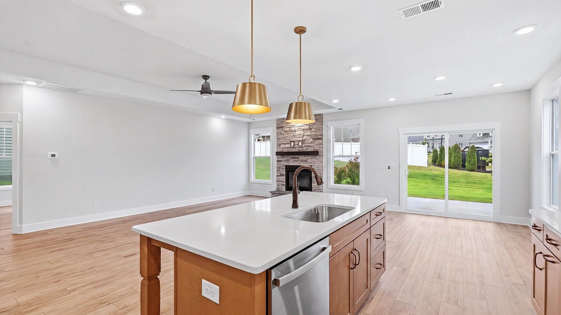 Memorable meals begin in this vibrant kitchen with pendant lighting and a thoughtfully designed island