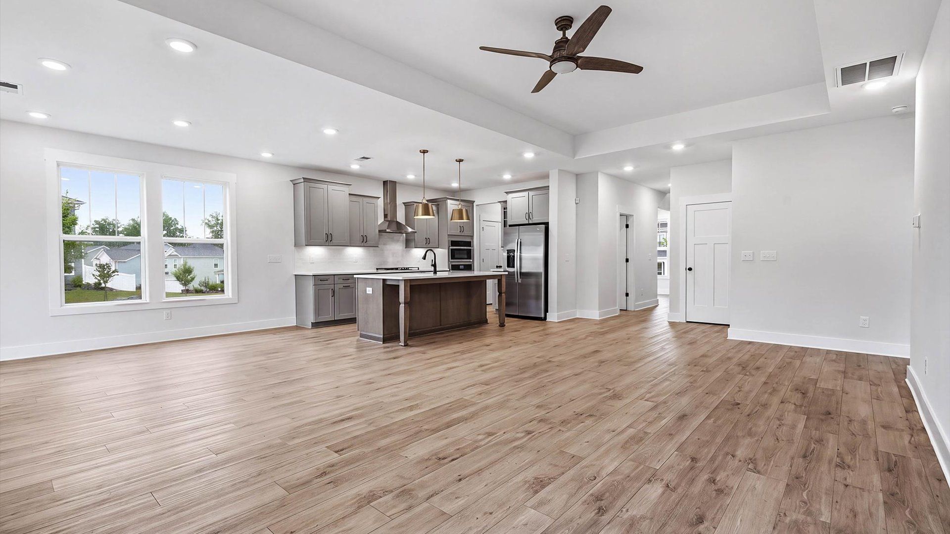 Vibrant and welcoming family room anchored by clean lines, tasteful materials, and abundant light in Spartanburg, SC