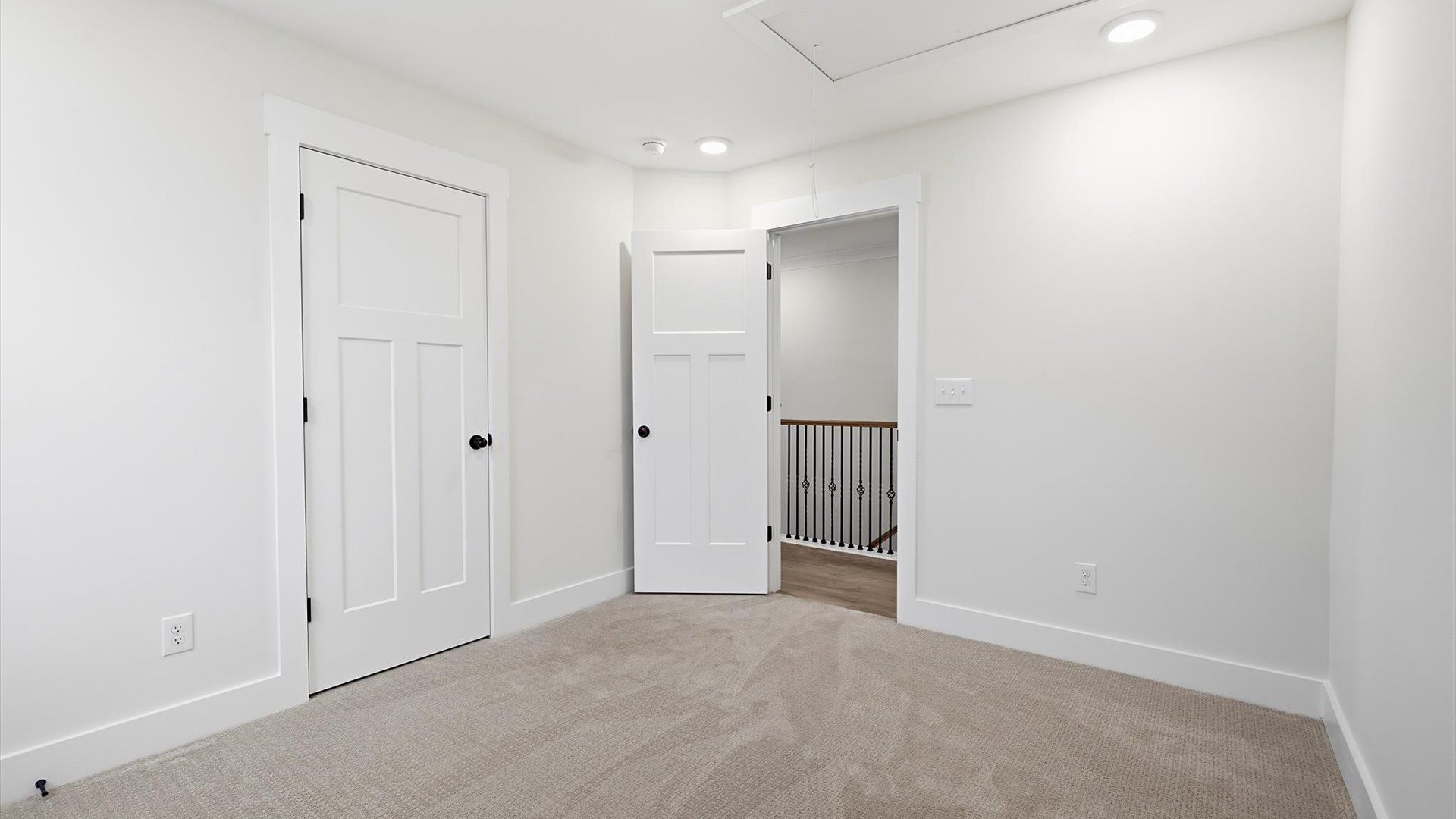 First-class secondary bedroom with comfortable carpeted flooring and generous closet space in Spartanburg, SC