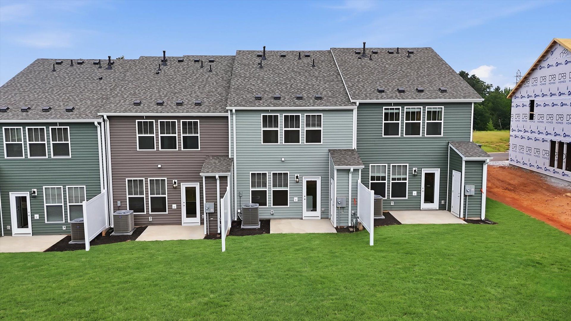 Warm and inviting outdoor living space with a private patio and tasteful finishes by DRB Homes