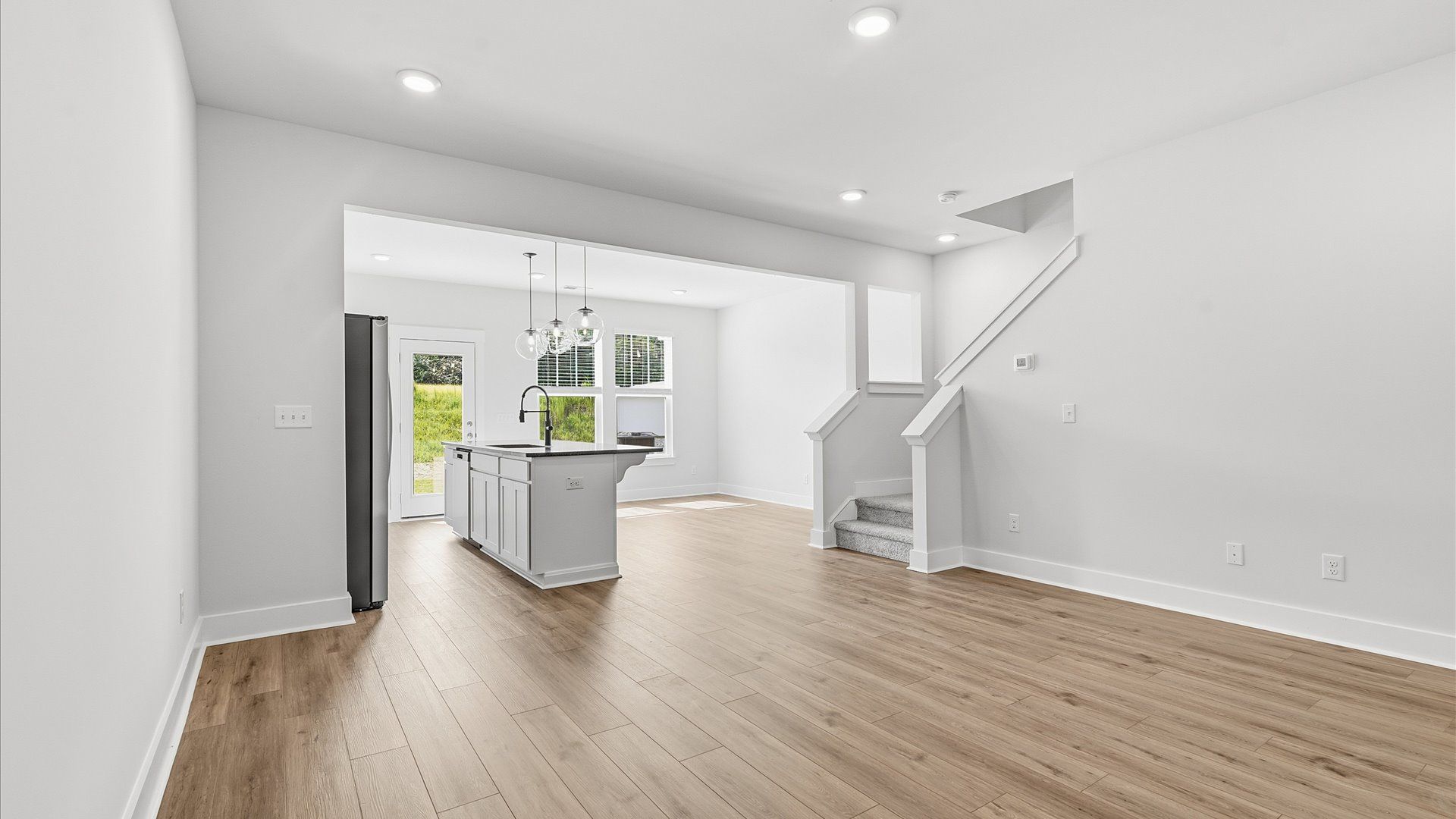 Hardwood flooring and high standards define this vibrant family room ideal for everyday living