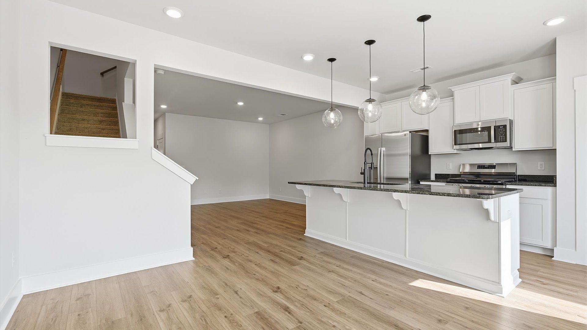 Inviting breakfast area with a seamless connection to the kitchen for everyday living at the Marion Square community