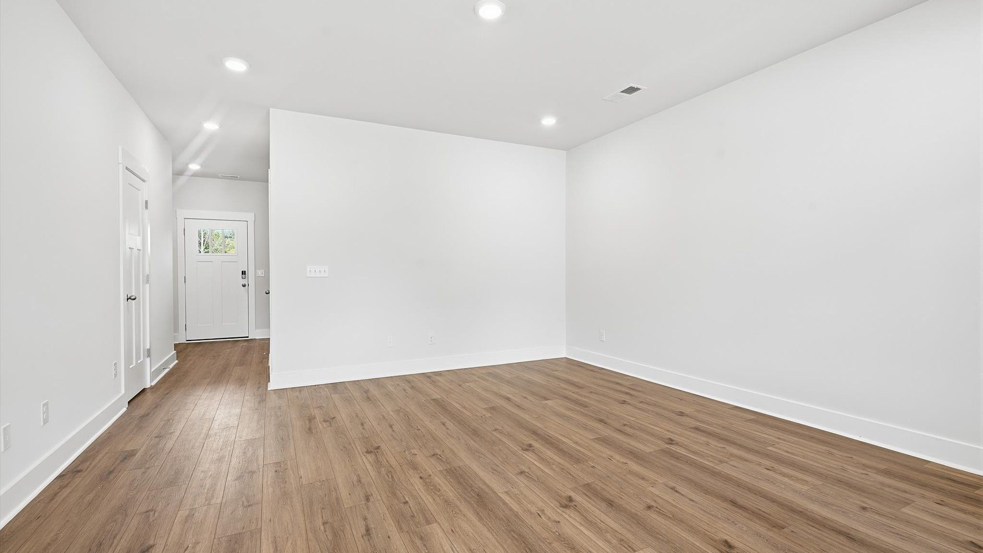 Elegant family room featuring hardwood flooring and thoughtful architectural detail by DRB Homes