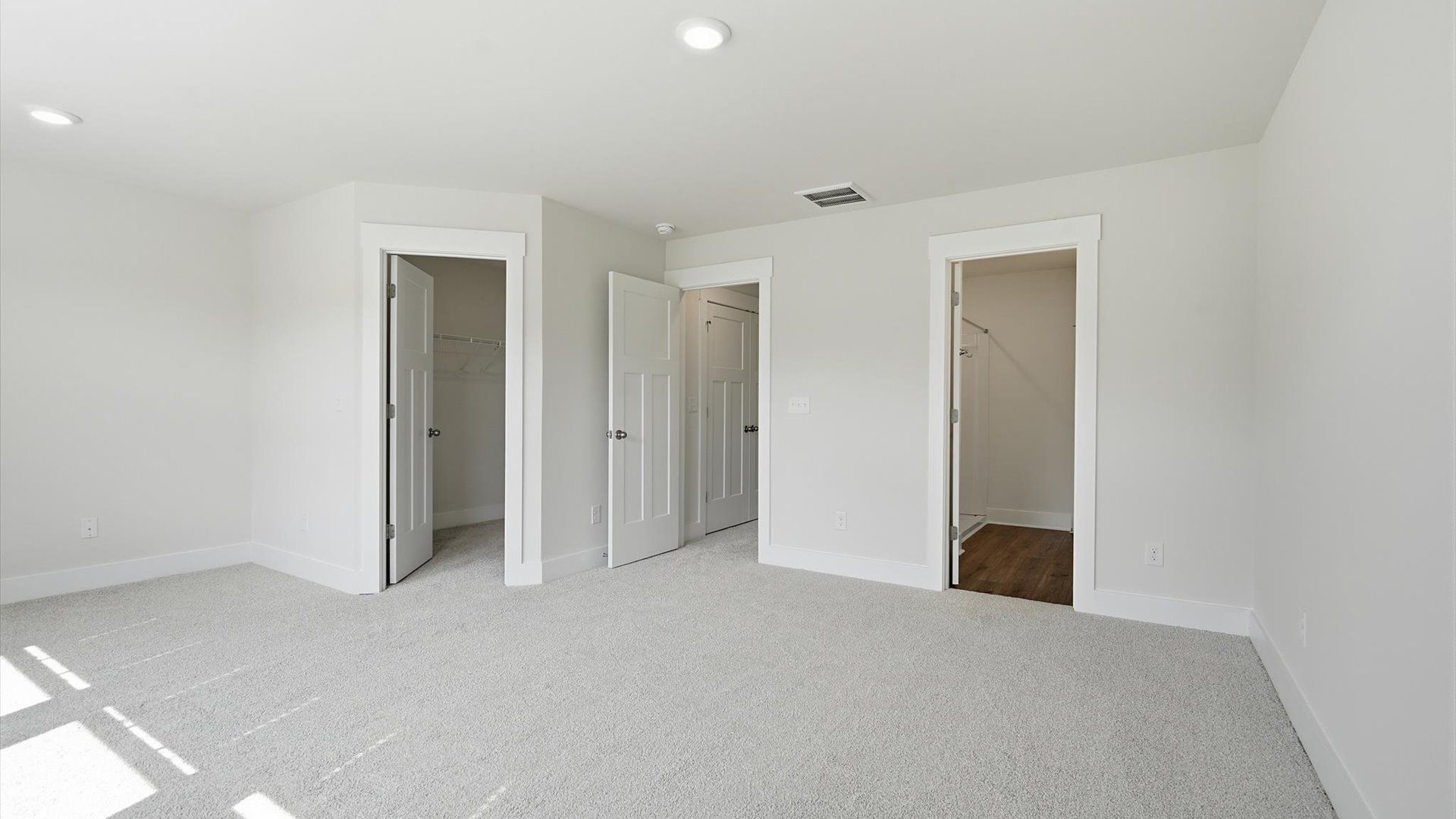Exclusive upstairs retreat with a bright and airy primary suite with a walk-in closet