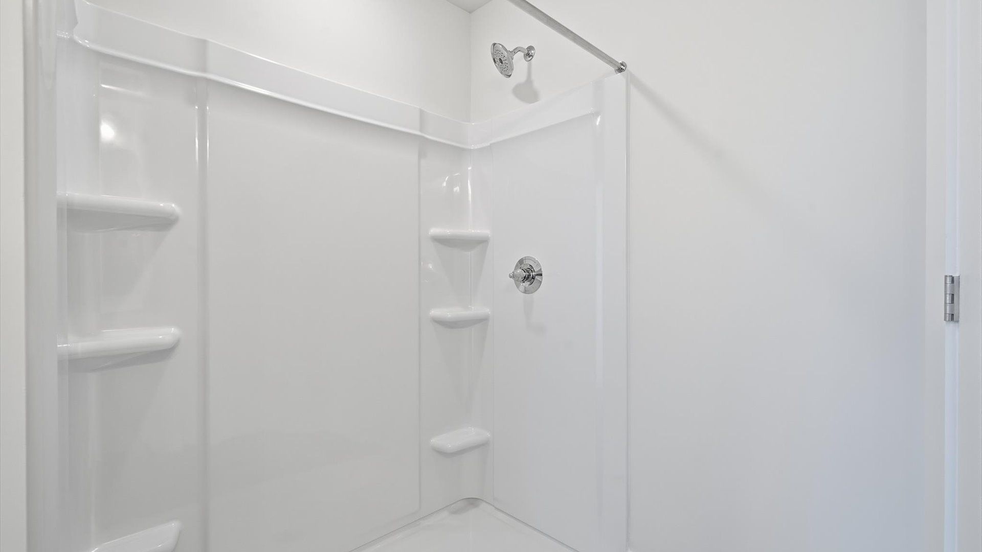 Superior en-suite primary bathroom with a stylish walk-in shower—crafted with high standards in mind