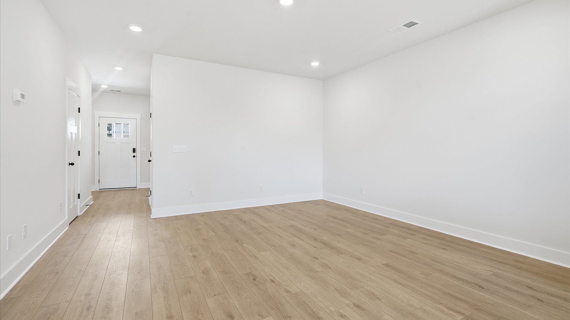 Elegant family room with hardwood flooring and open-concept flow in this first-class DRB Homes design