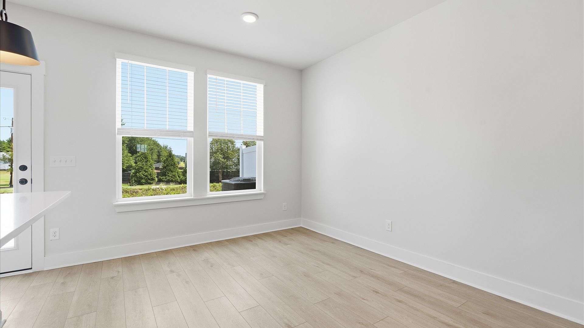 Open-concept breakfast area with seamless flow into the kitchen and family room