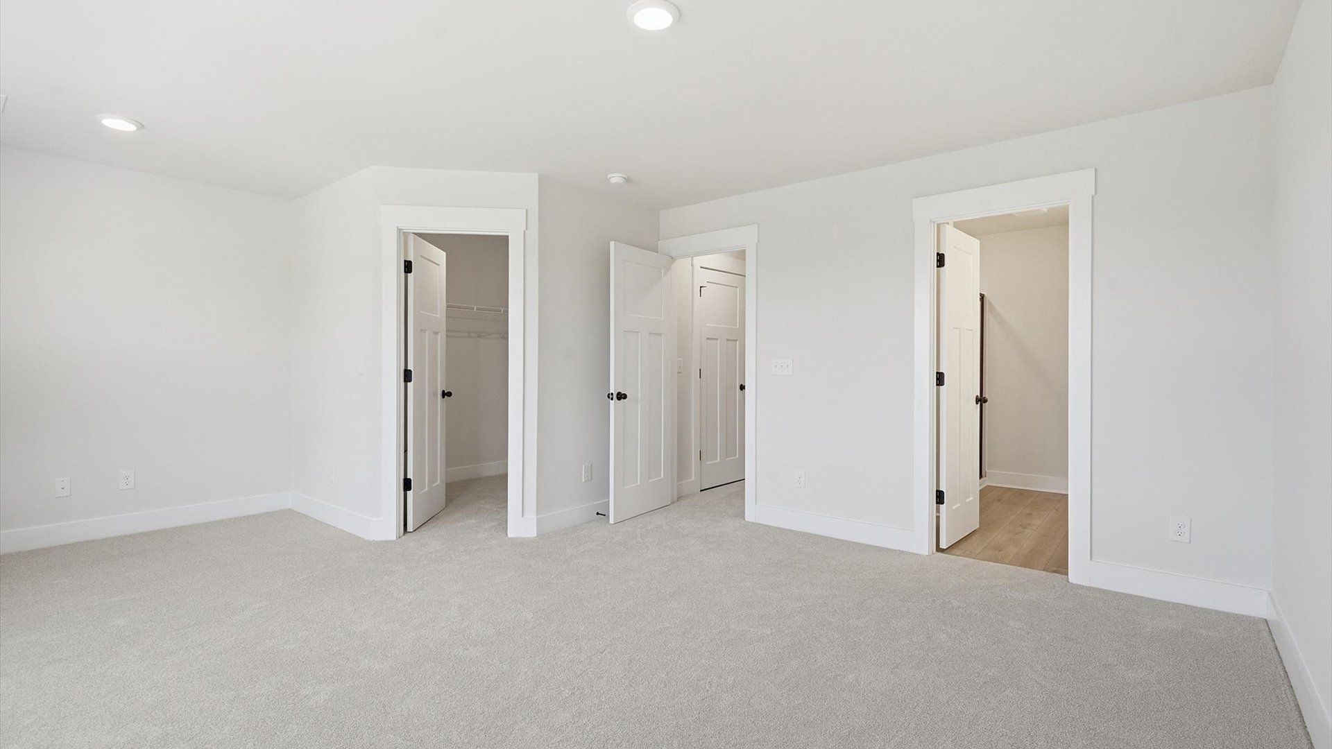 Eye-catching details and elegant finishes in the vibrant primary suite of this select home