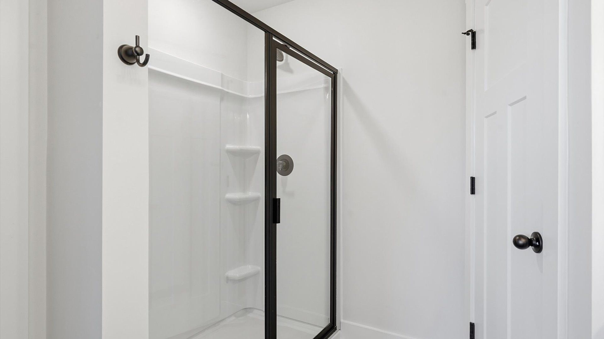 Spacious and modern primary bathroom with walk-in shower and first-class double vanity setup