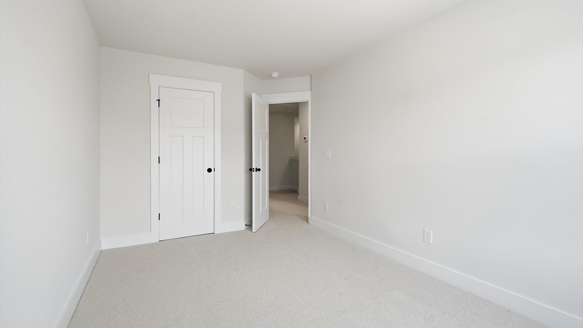 Superior comfort in this light-filled bedroom with plush carpeting and thoughtfully placed large windows