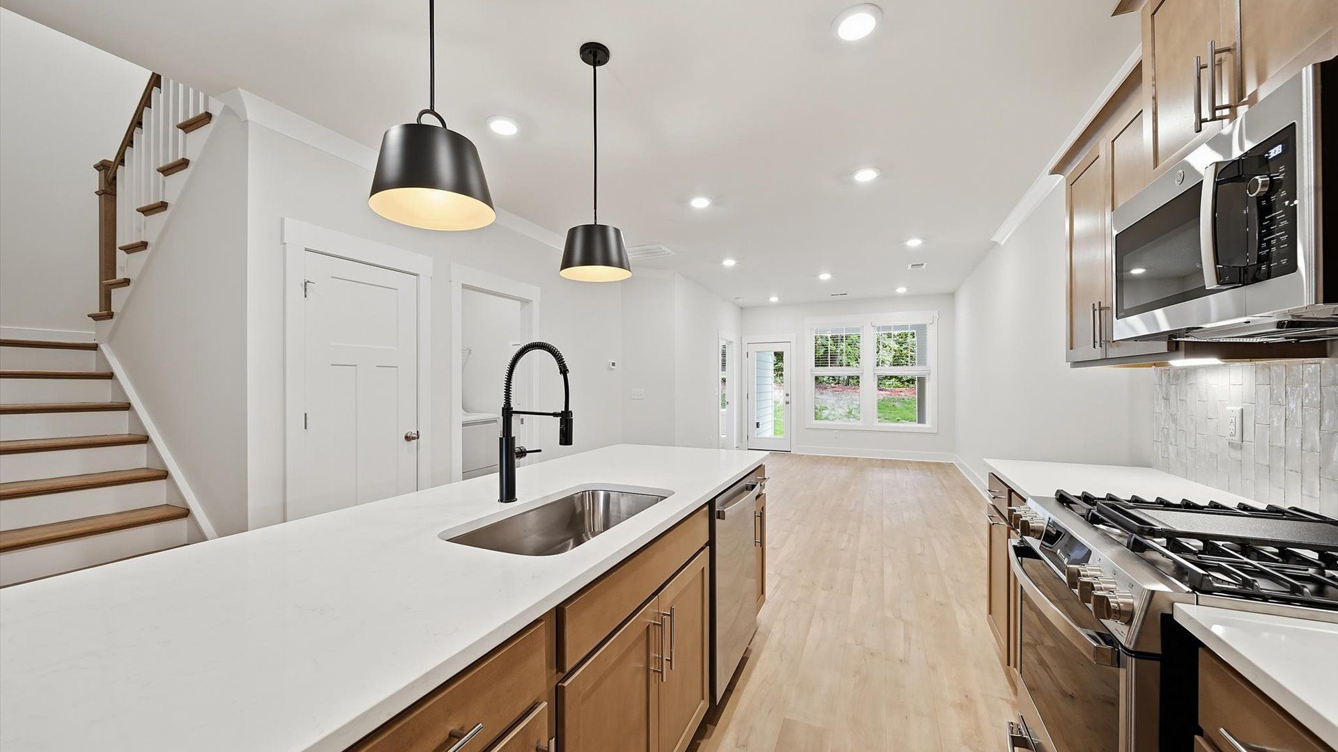 Well-designed kitchen with a center island and tasteful finishes that elevate everyday living
